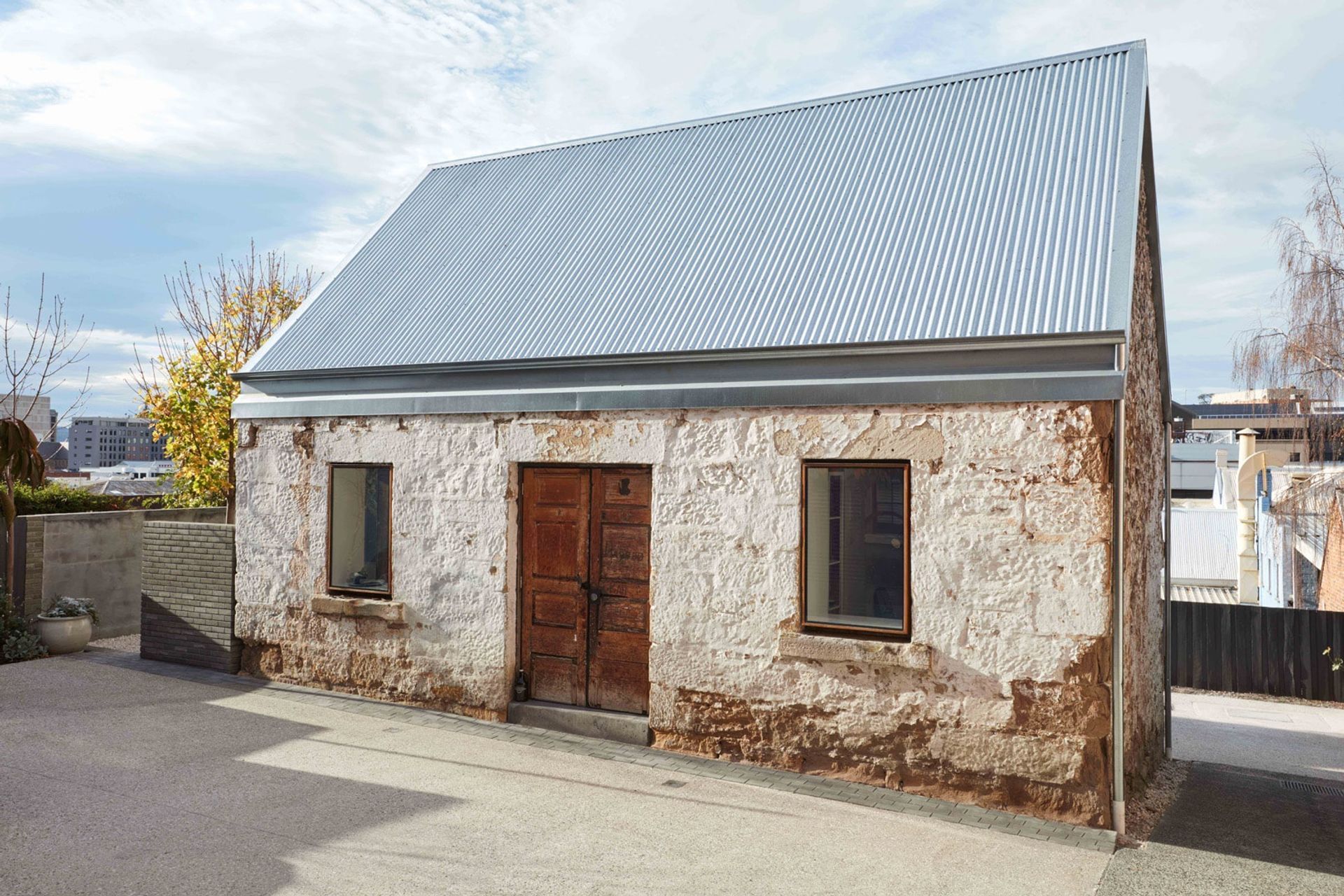 As much of the original stonework as possible was retained in the renovation. Photography: Sean Fennessey Photography.