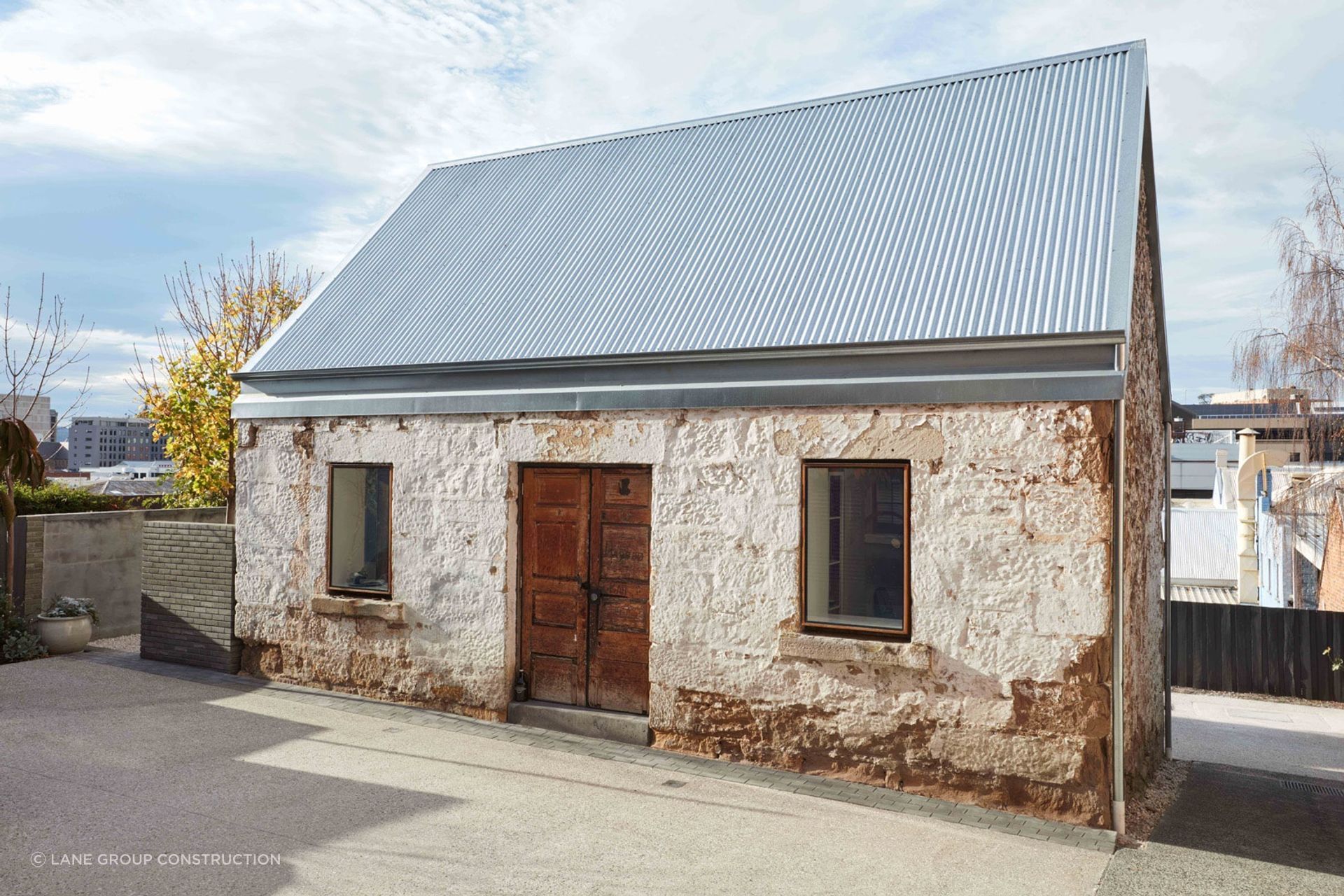 As much of the original stonework as possible was retained in the renovation. Photography: Sean Fennessey Photography.
