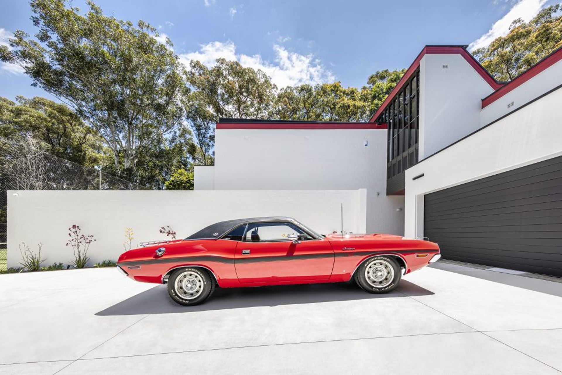 A car parked in the driveway of the Pymble home. Image Murray Fredericks