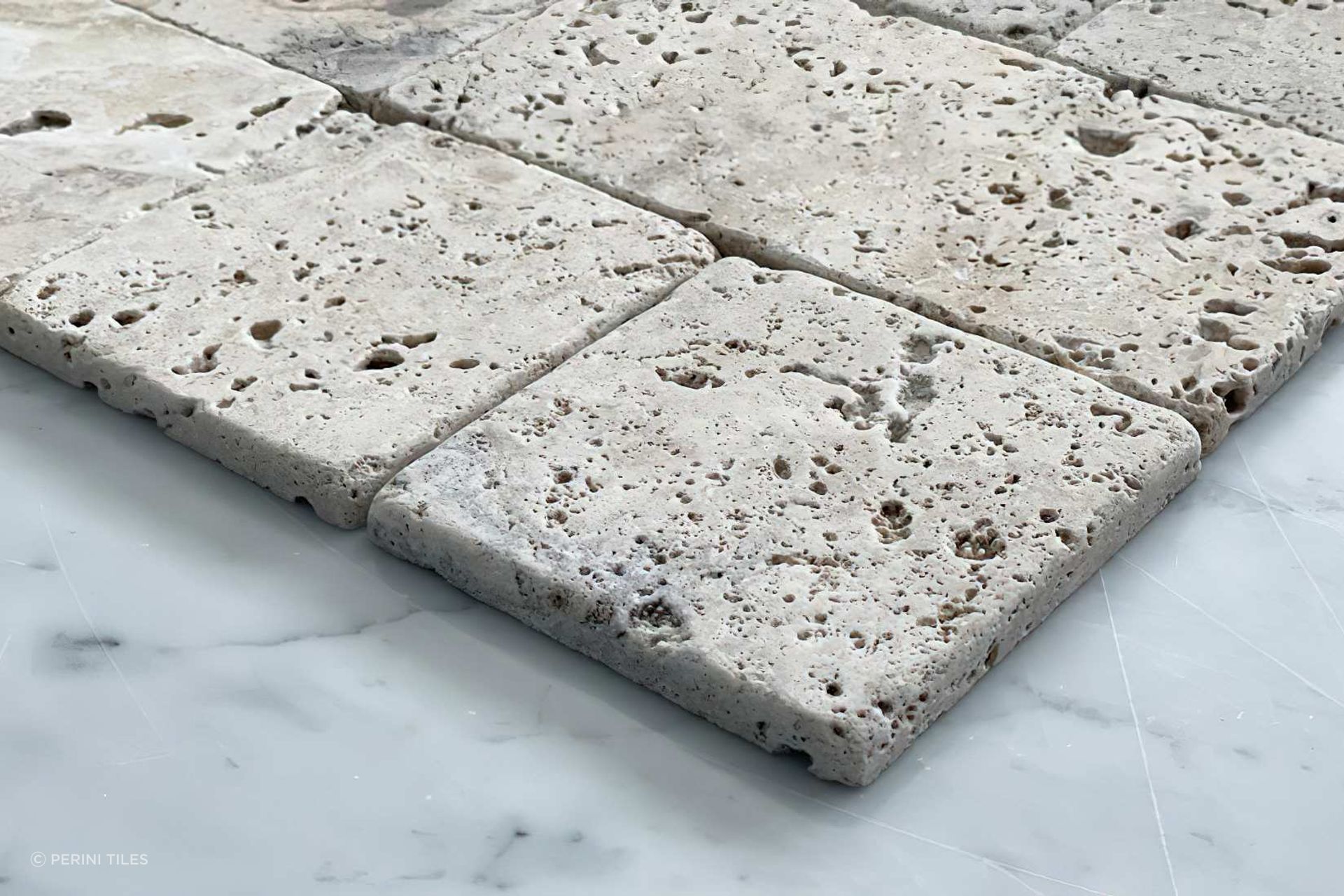 Travertine tiles are often used as a pool surround tile as they offer incredible slip resistance in these sorts of applications. Our Tumbler travertine tile collection is available in a selection of rich and earthy tones. Combining classic square tiles and subway tiles, Tumbler offers a unique sense of pattern that is ideal for complementing your home’s outdoor areas.