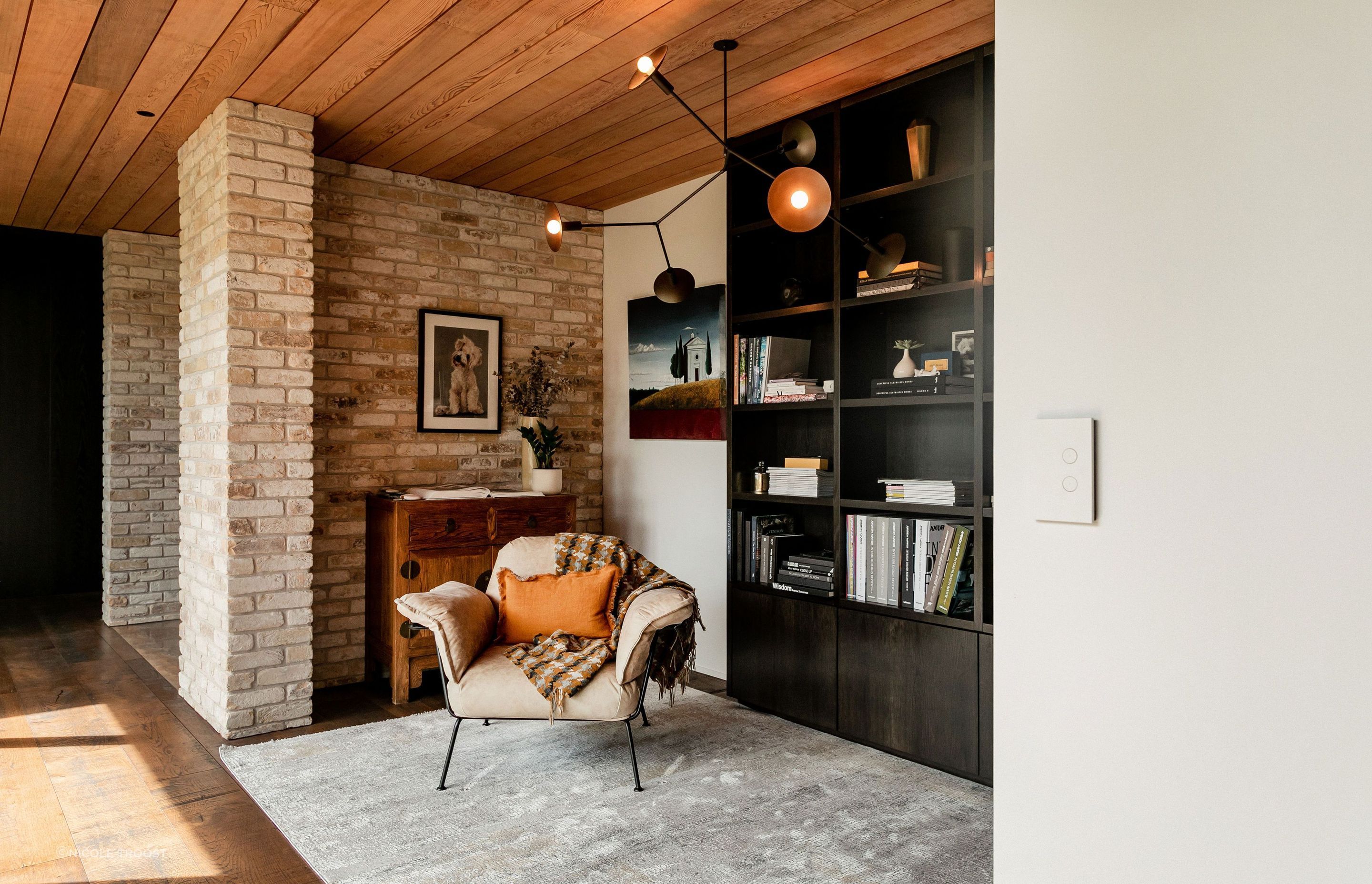 The library nook tucked into the hallway has a lovely view out over the internal courtyard.