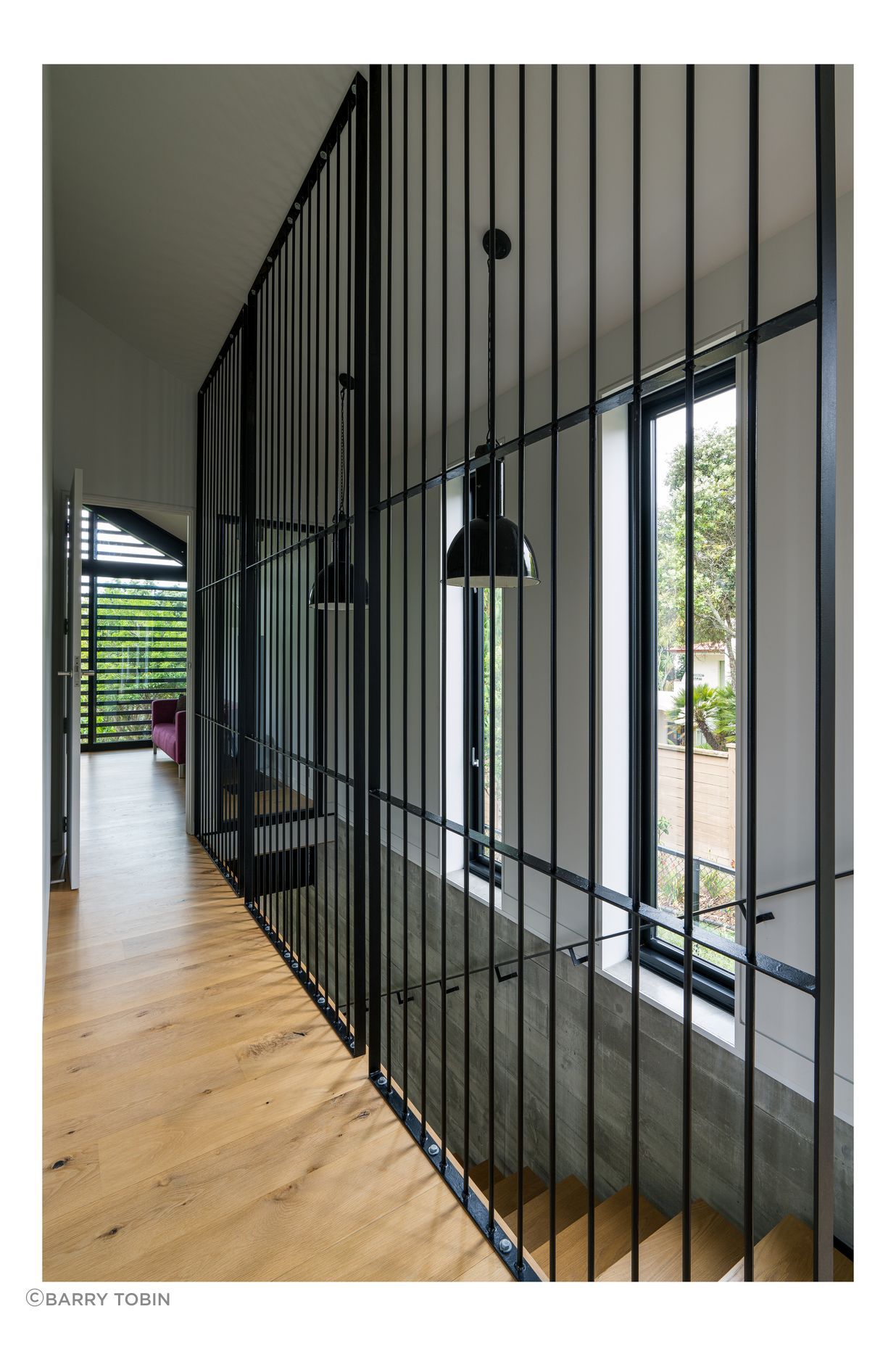Clive wanted to separate the stairwell but not put in a solid wall. He considered black netting before trying the metal rods, framing them into panels to stop them flexing. “It was an aesthetic that just developed, and met my design idea to keep the hallway as open as possible.”