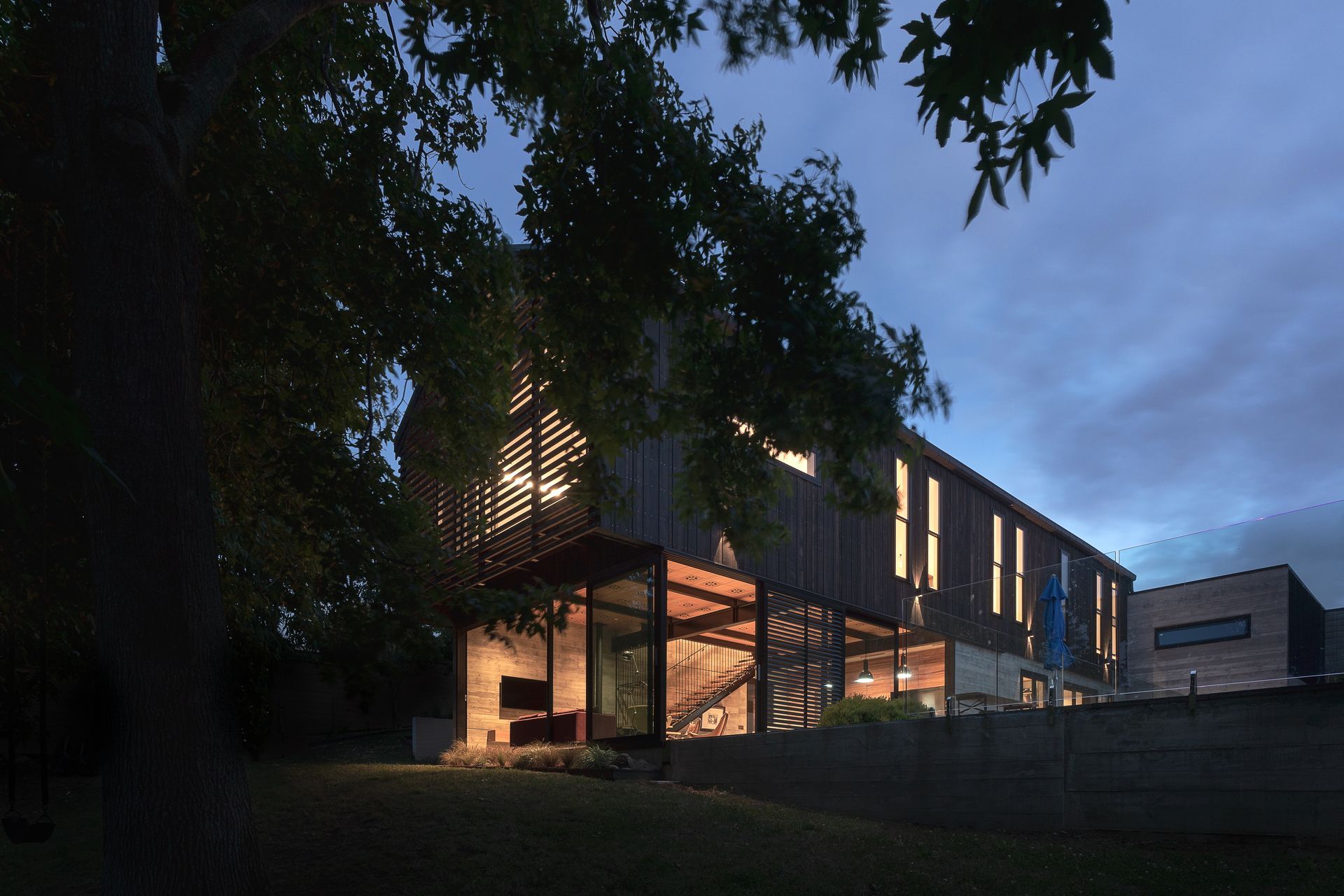 “Because all the upstairs rooms are single-sided you can’t achieve cross flow ventilation. So we used double hung sashes, like you get in the old villas, which allow hot air to exit at the top as cool air comes in the bottom.” The added benefit of a large patio is the family can plan outdoor movie nights: the concrete lower portion of the garage wall was always intended to serve as an outdoor screen.