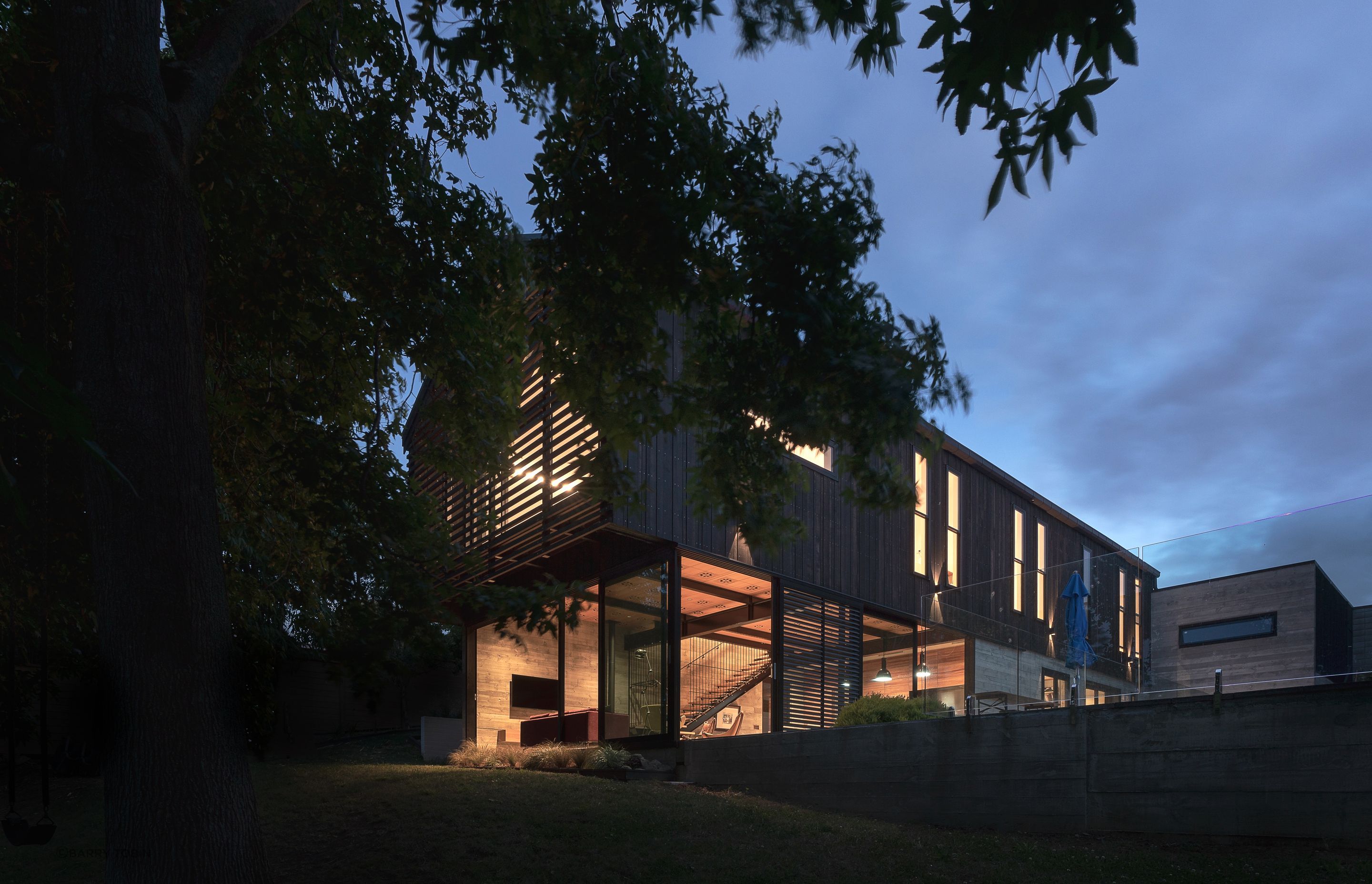 “Because all the upstairs rooms are single-sided you can’t achieve cross flow ventilation. So we used double hung sashes, like you get in the old villas, which allow hot air to exit at the top as cool air comes in the bottom.” The added benefit of a large patio is the family can plan outdoor movie nights: the concrete lower portion of the garage wall was always intended to serve as an outdoor screen.