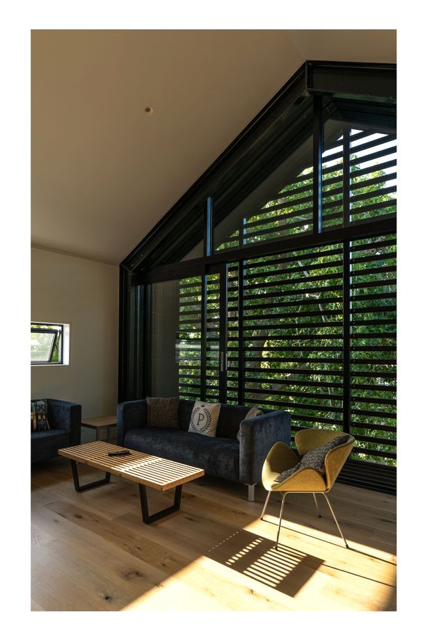 The upstairs living room is very useful with teenage children. “The kids tend to use it when they have friends over. In the summertime the large sliding windows can be left open to ventilate the house. We can leave it open without any security issues because it has the slats across it, which also double as sun control.”