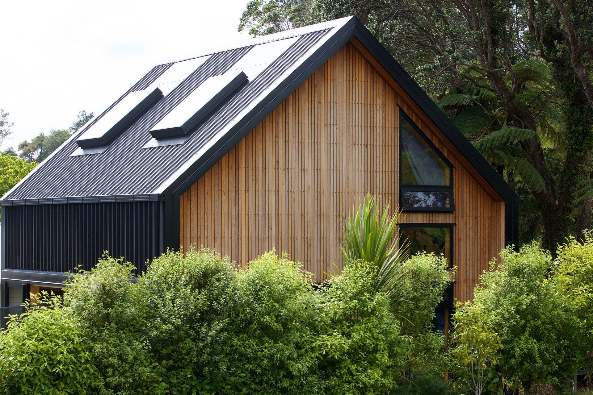 The sleek gable roof profile of 'Mandy's Home' as seen from the street.
