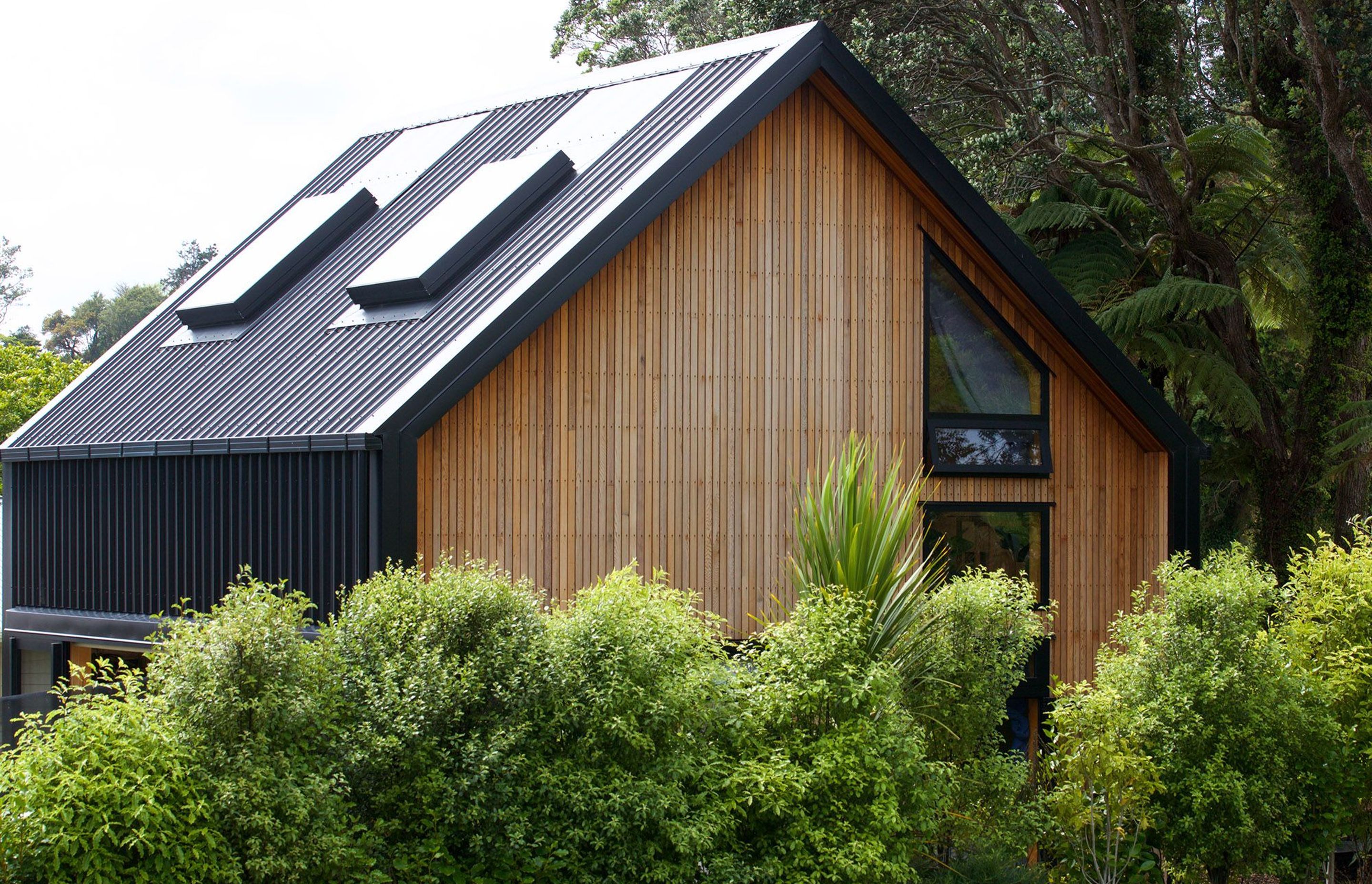 The sleek gable roof profile of 'Mandy's Home' as seen from the street.