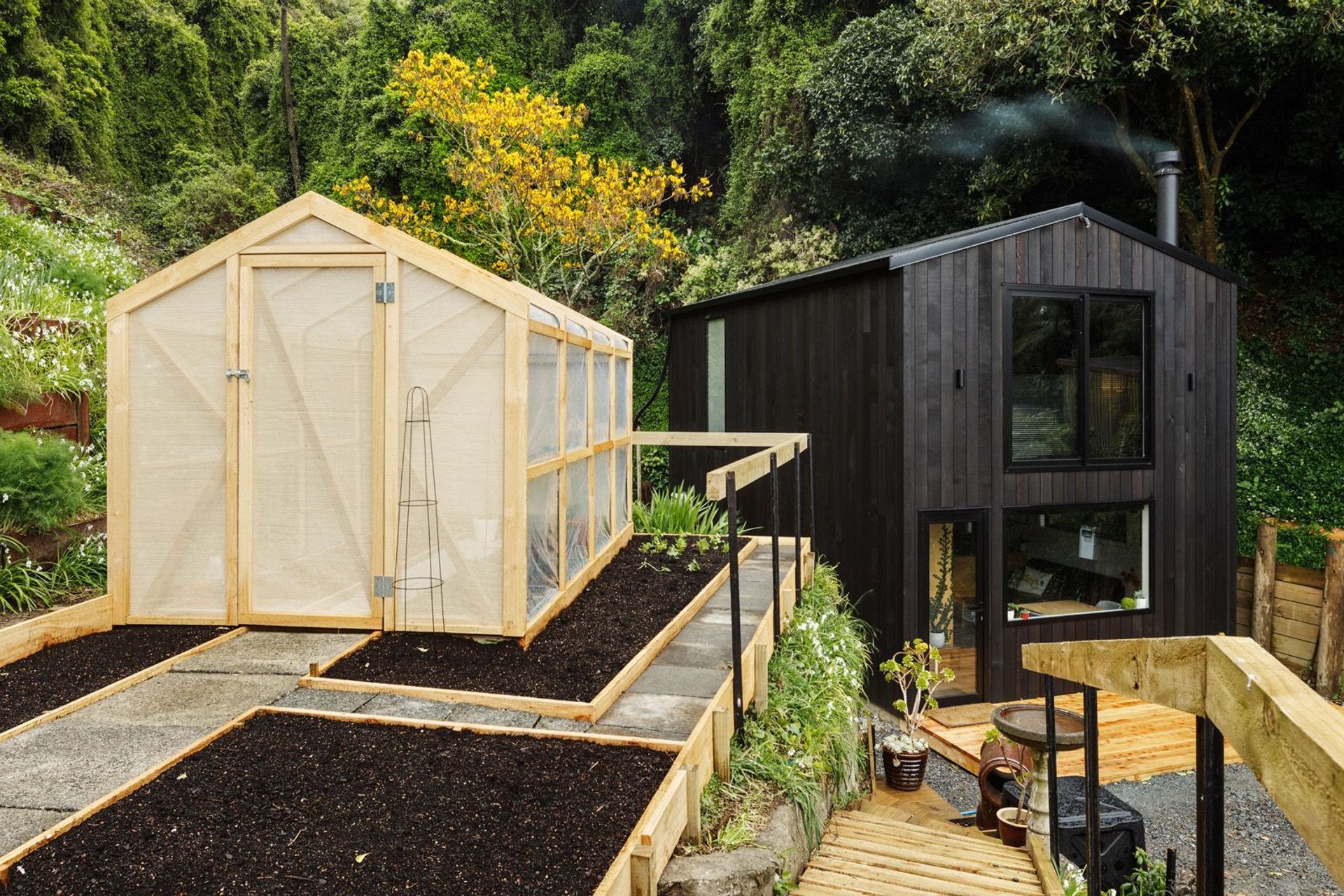 One of a new breed of modest but well-designed New Zealand homes, this 64m² tiny house is occupied by builder Rhys Doesburg and his family while he plans a larger house on this infill site in Wellington. Photograph by Andre Vroon.