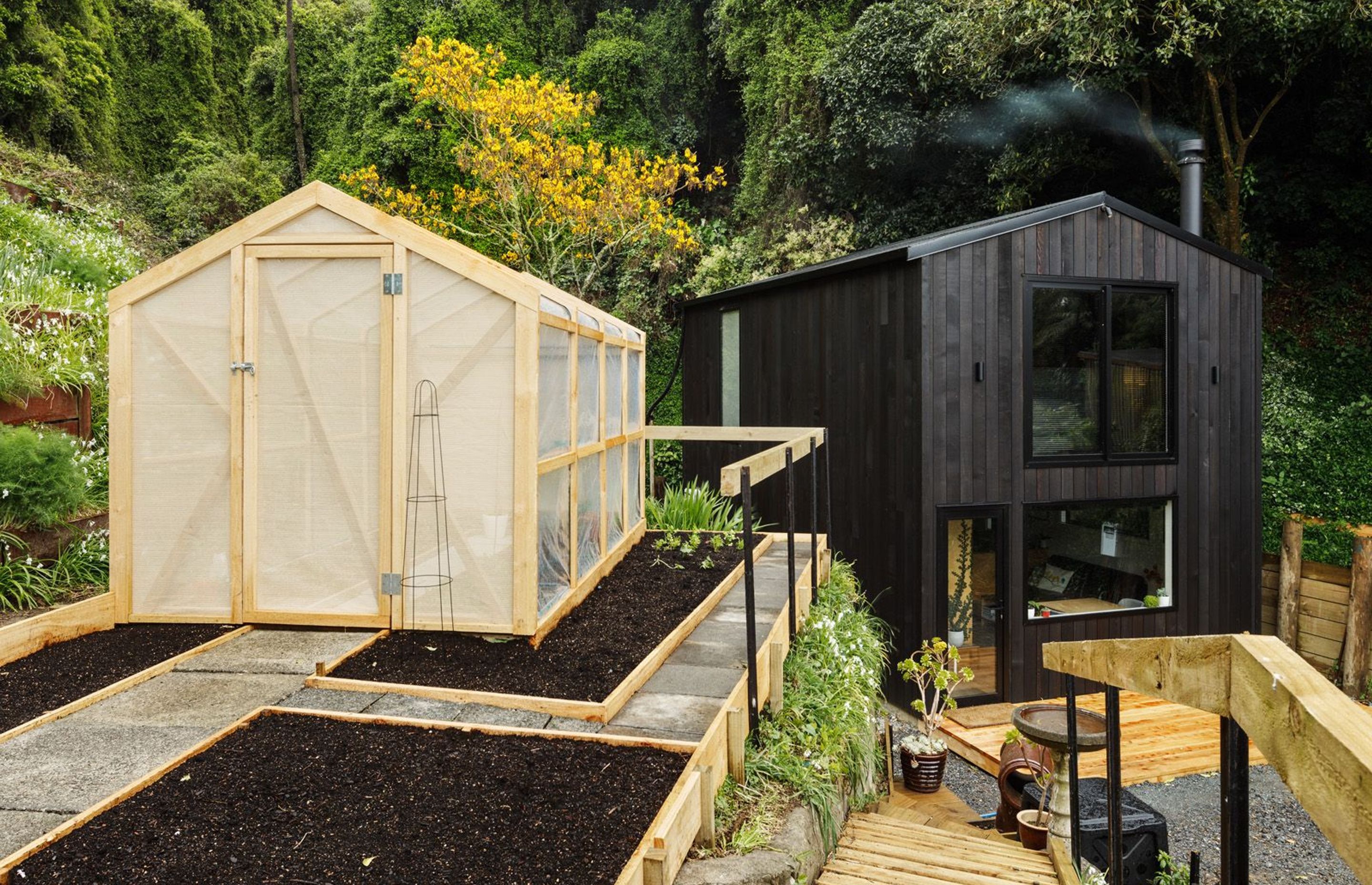 One of a new breed of modest but well-designed New Zealand homes, this 64m² tiny house is occupied by builder Rhys Doesburg and his family while he plans a larger house on this infill site in Wellington. Photograph by Andre Vroon.