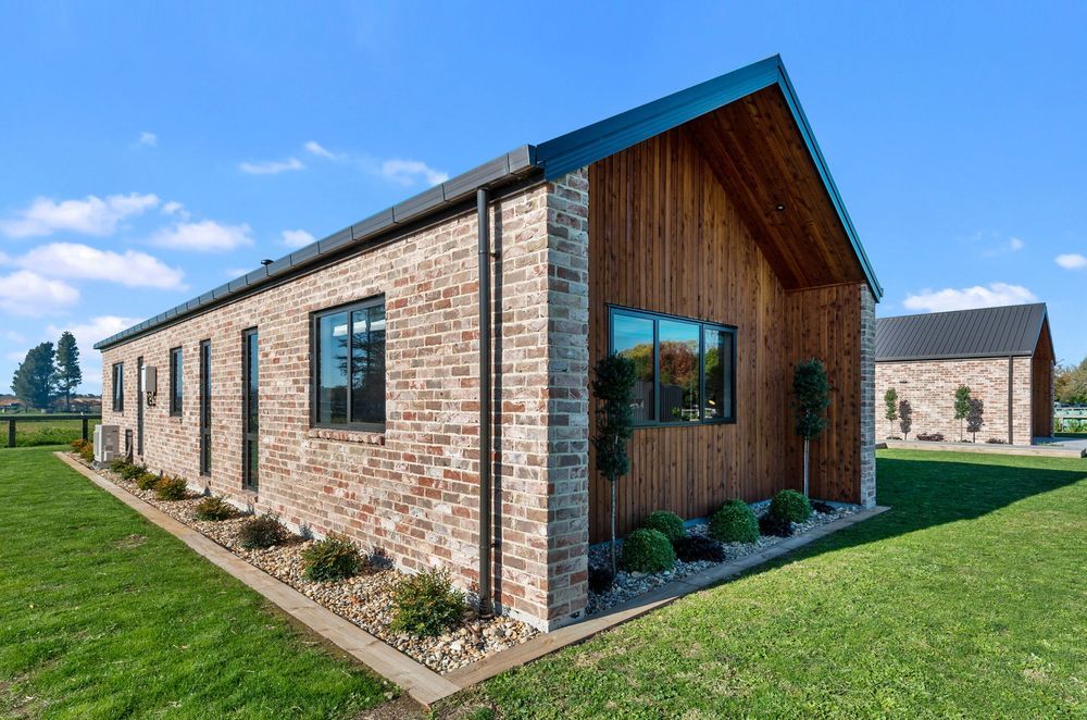 The Austral bricks from The Brickery are manufactured to look aged, a look that references reclaimed bricks from the Christchurch earthquakes that are no longer easy to find. The extended walls at the gable end provided room for extra planting.