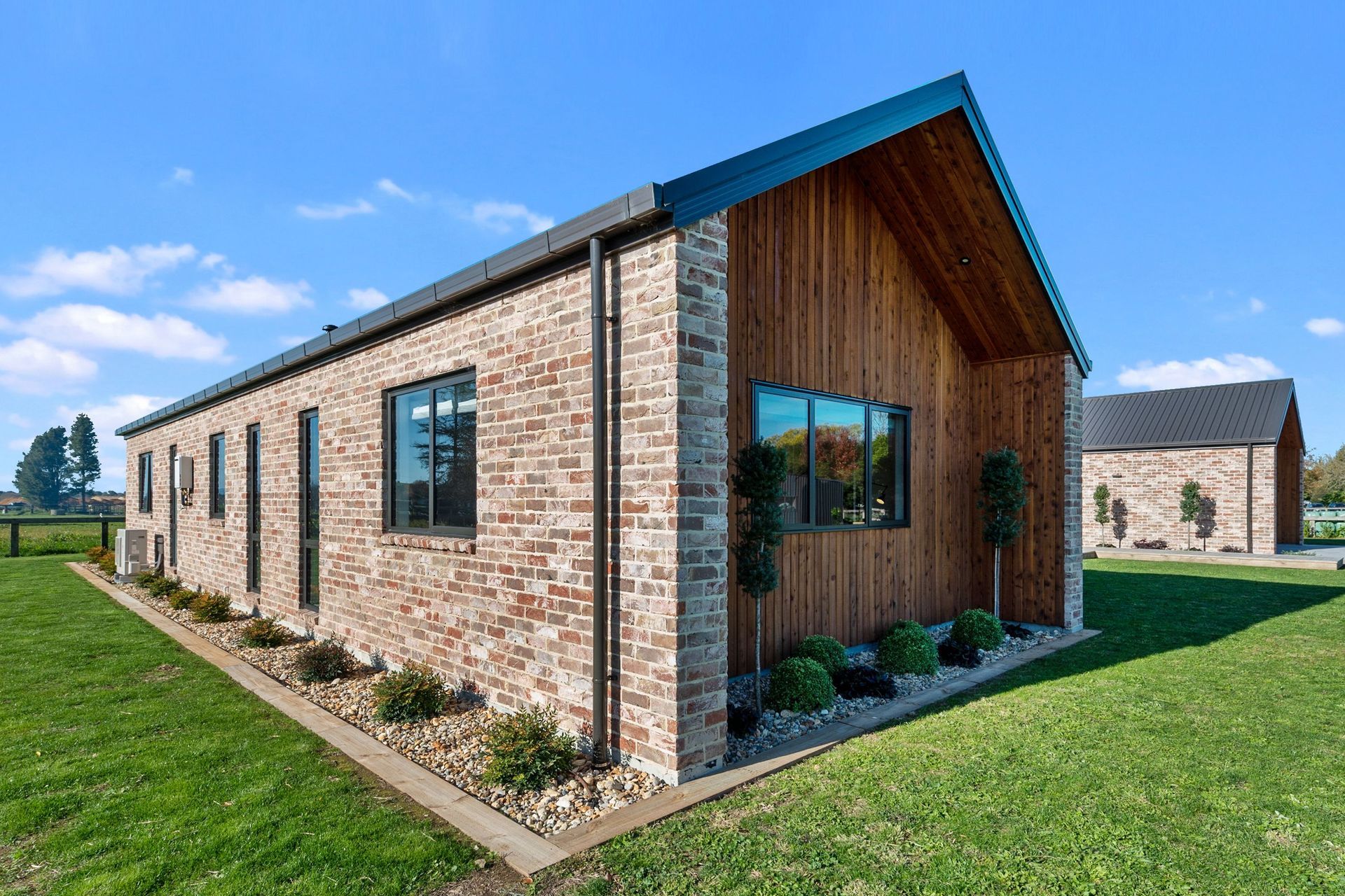 The Austral bricks from The Brickery are manufactured to look aged, a look that references reclaimed bricks from the Christchurch earthquakes that are no longer easy to find. The extended walls at the gable end provided room for extra planting.