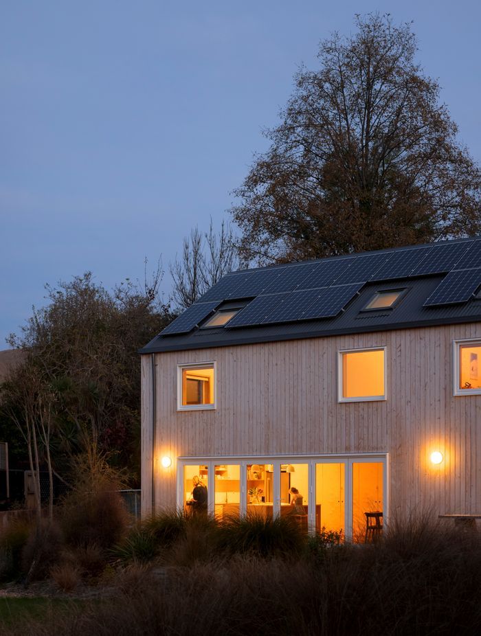 Solar panels line the roof, providing renewable energy to the family home.
