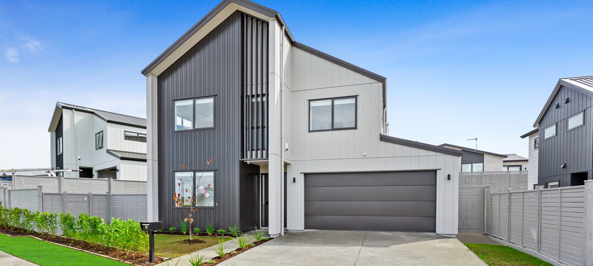 Flatline Smooth sectional door with Negative detail in Colorsteel Windsor Grey