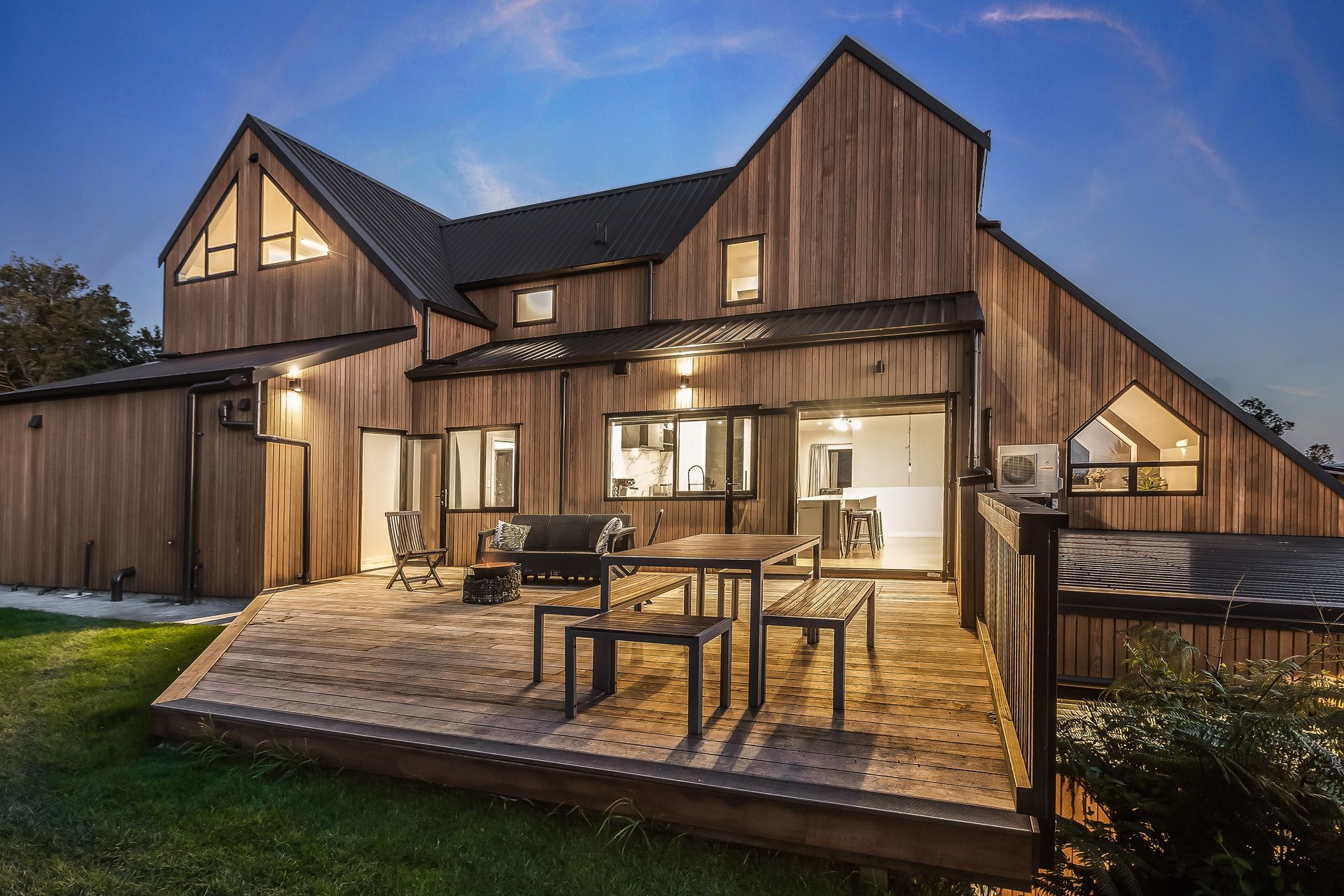 Exterior lighting was planned to highlight the home’s cedar cladding.