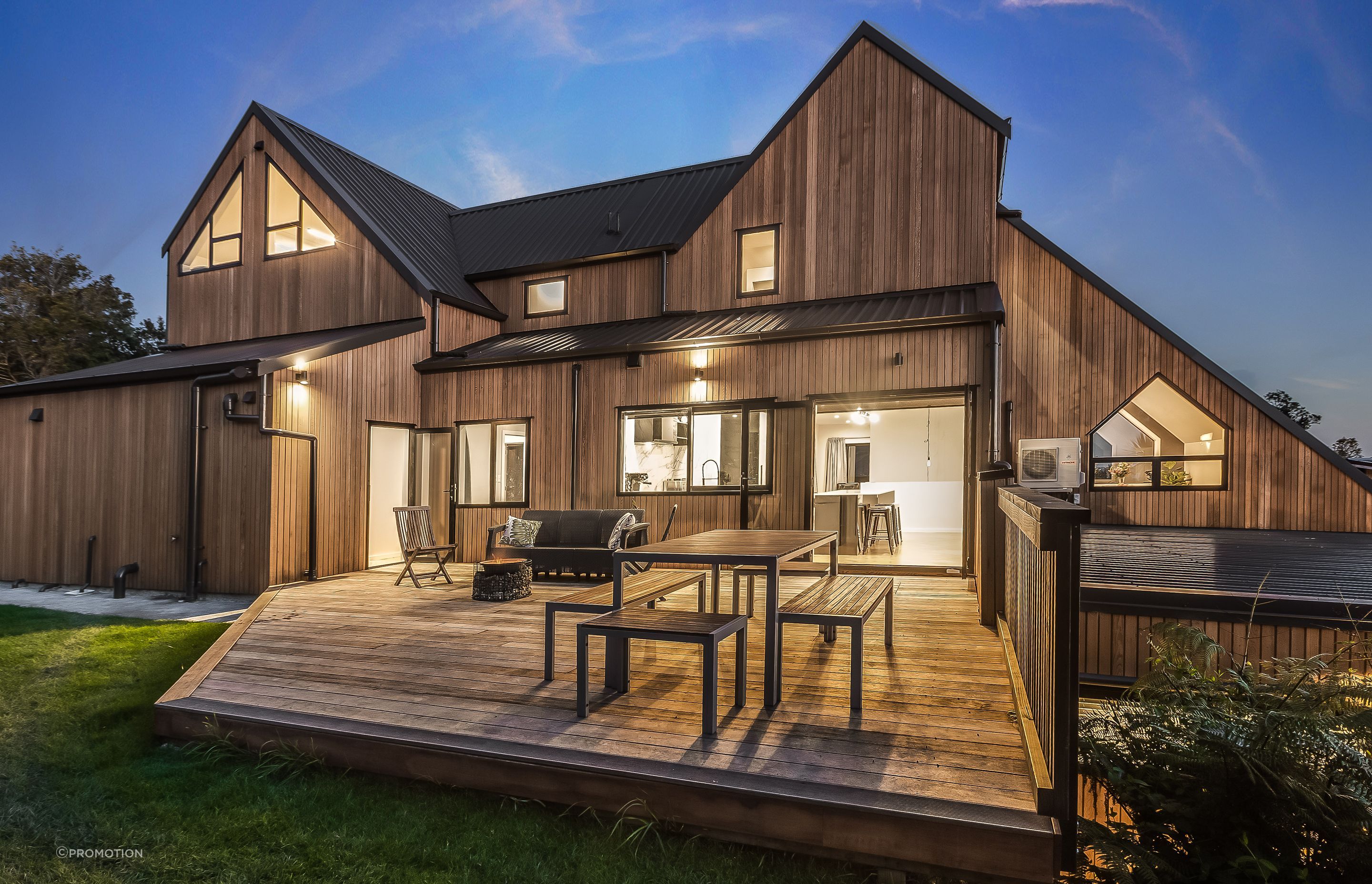 Exterior lighting was planned to highlight the home’s cedar cladding.