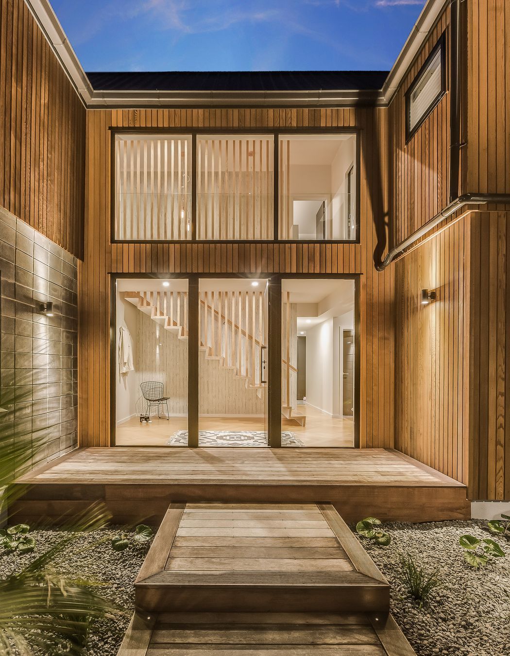 The entrance is one area where Tony recruited a professional: friend Jeremy Stratton of The Lawn Laying Company did the landscaping. “We thought it came up beautifully,” says Tony.