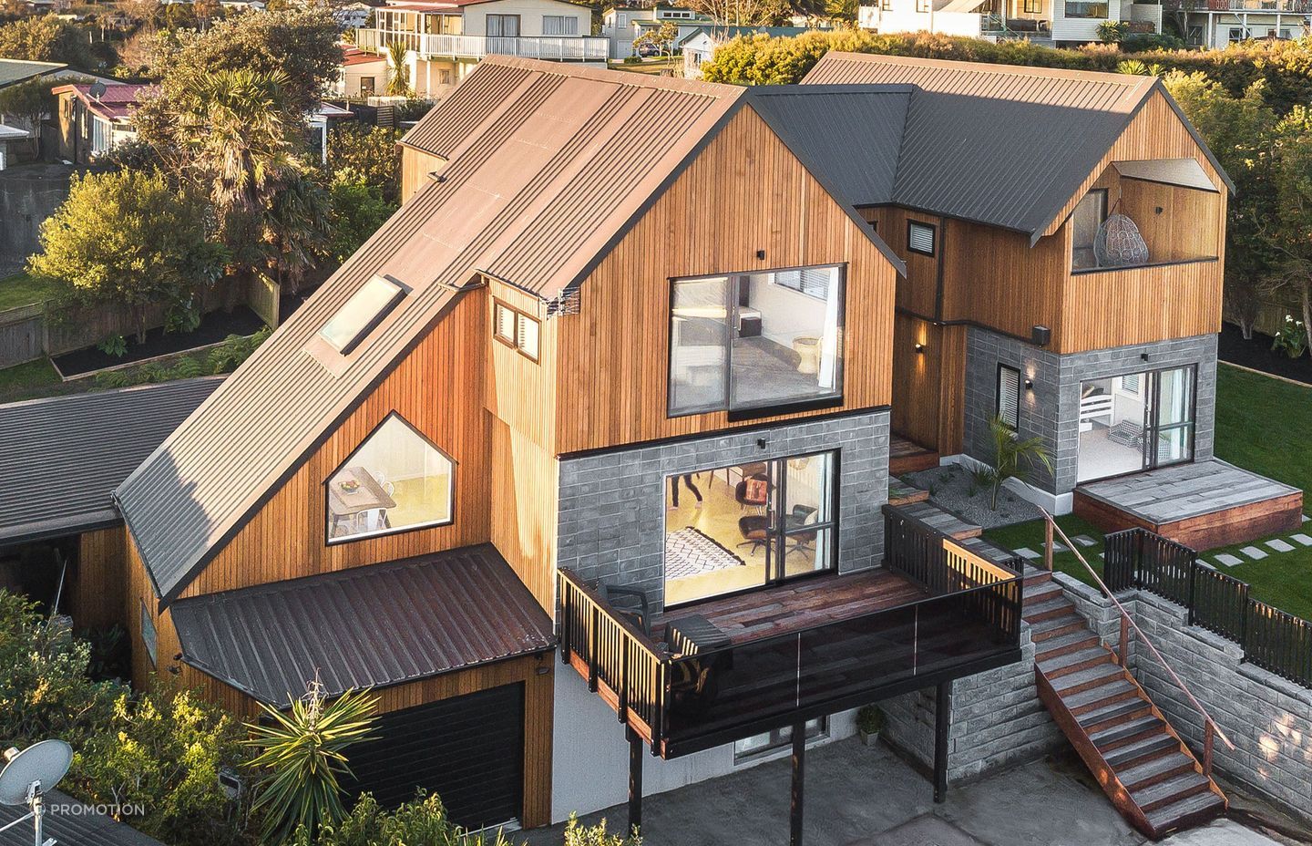 The home is clad with cedar shiplap by Hermpac and the roofing is Trimrib in Ironsand by Roofing Industries. Homeowner and builder Tony Buchanan installed the roof himself with his crew - some of the runs were up to 12m long.