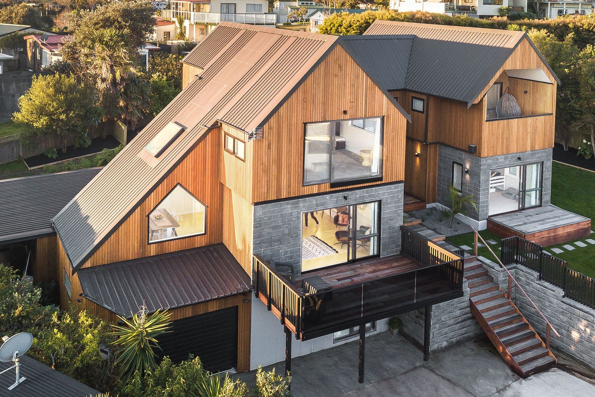 The home is clad with cedar shiplap by Hermpac and the roofing is Trimrib in Ironsand by Roofing Industries. Homeowner and builder Tony Buchanan installed the roof himself with his crew - some of the runs were up to 12m long.