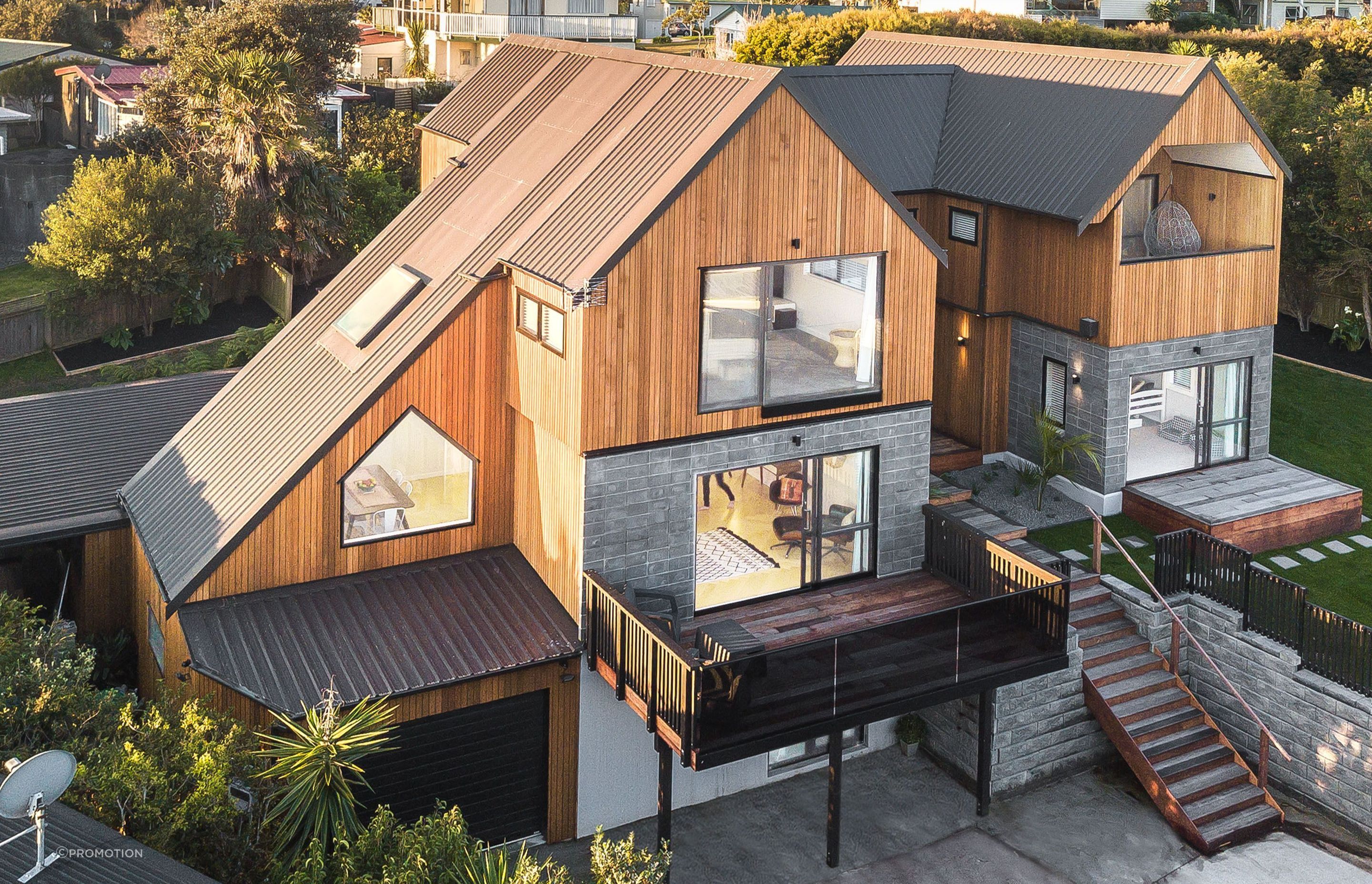 The home is clad with cedar shiplap by Hermpac and the roofing is Trimrib in Ironsand by Roofing Industries. Homeowner and builder Tony Buchanan installed the roof himself with his crew - some of the runs were up to 12m long.