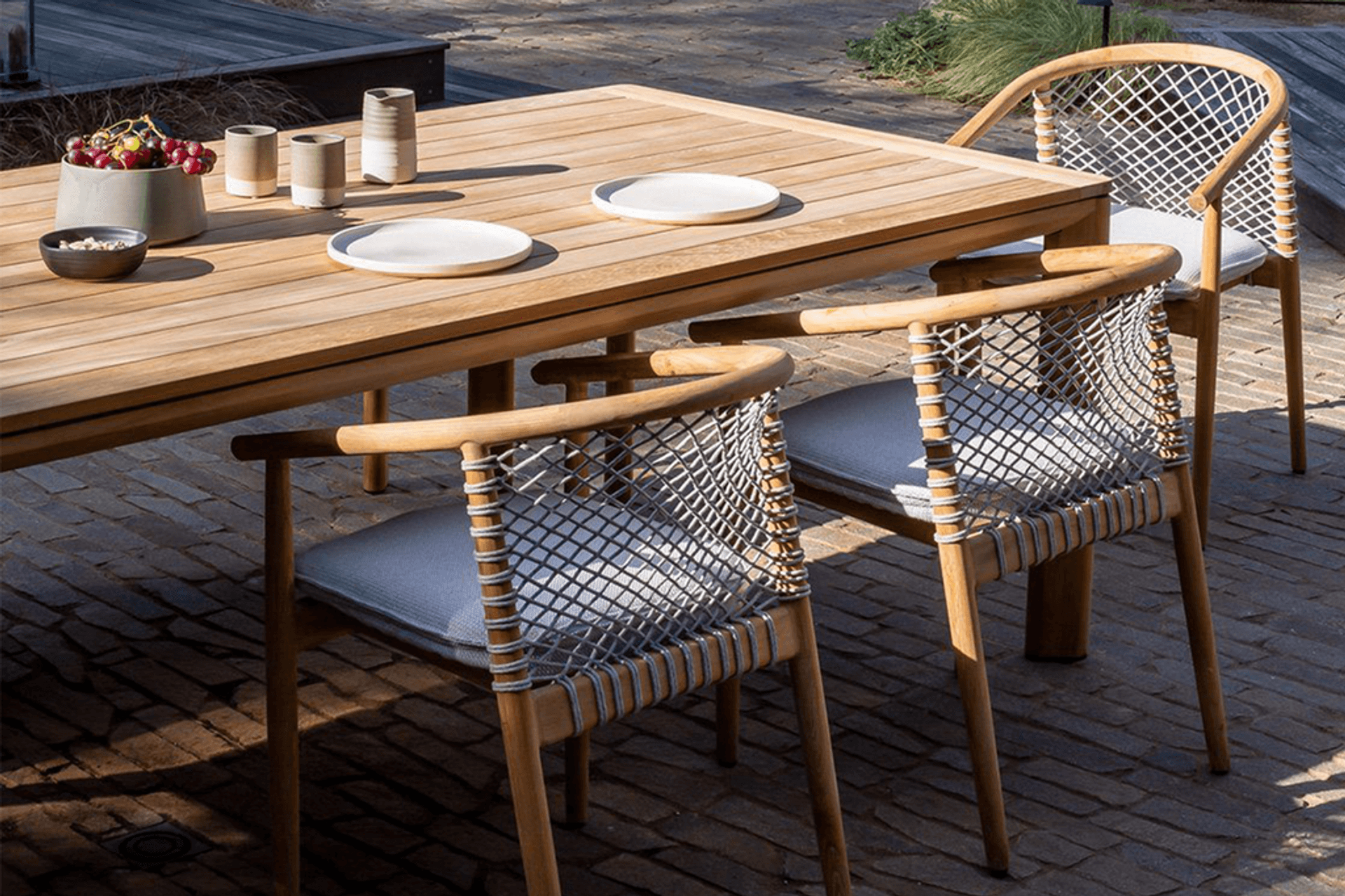 Pictured: Addis Teak Dining Table and Forrest Armchairs by Kett.