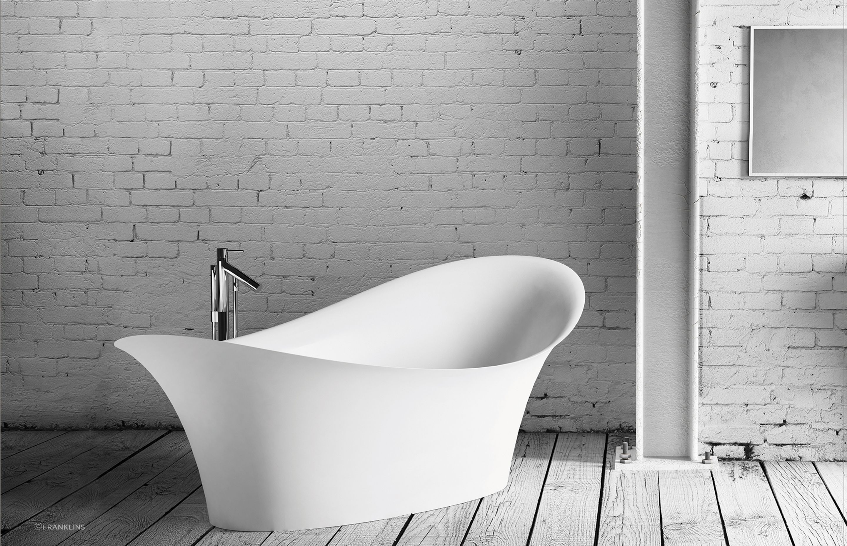 The sculptural curvaceous forms of the Marmorin Alice Freestanding Bath for an indulgent bathroom design