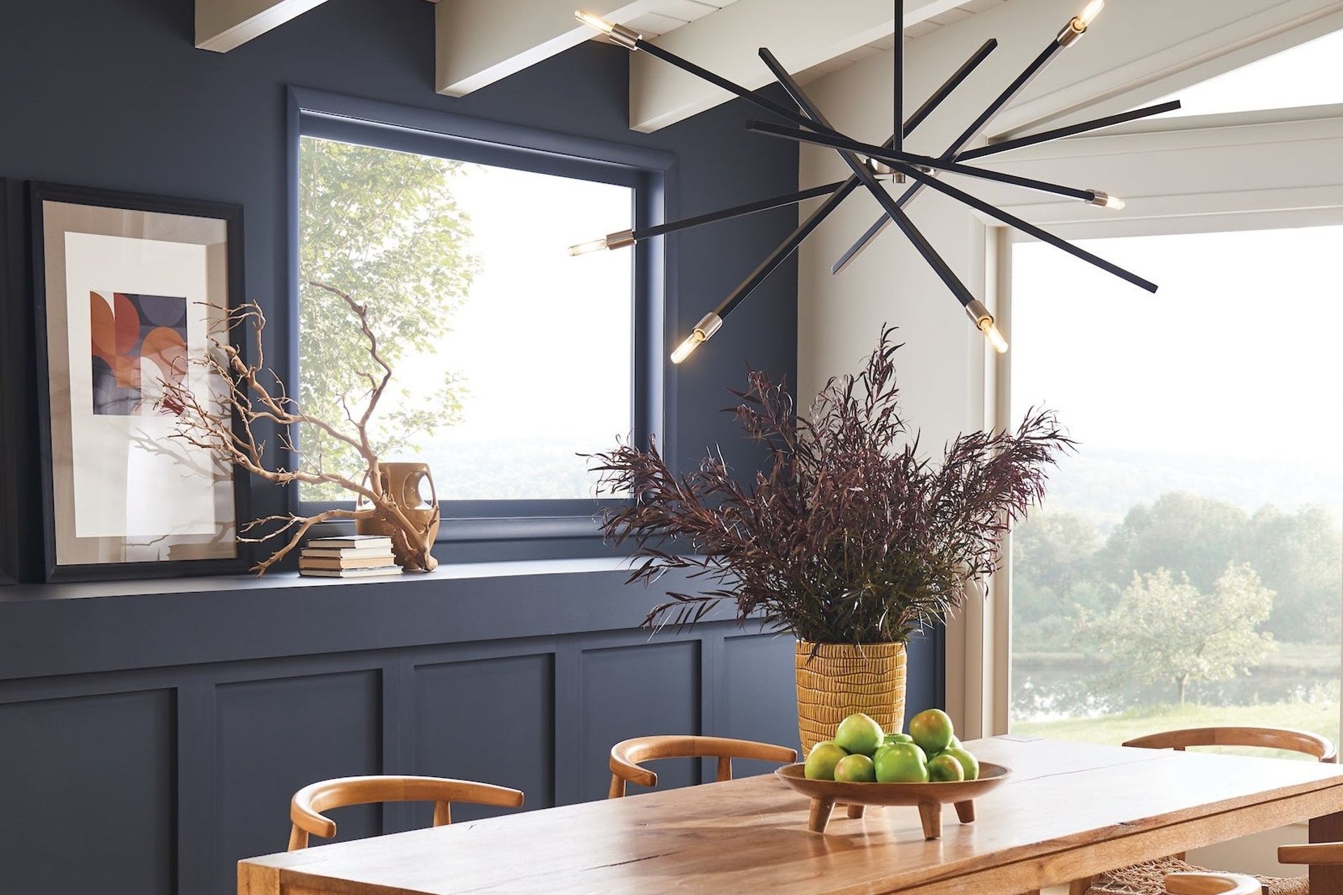 The versatile and contemporary Archer Pendant with articulating arms in satin black with brushed nickel accents