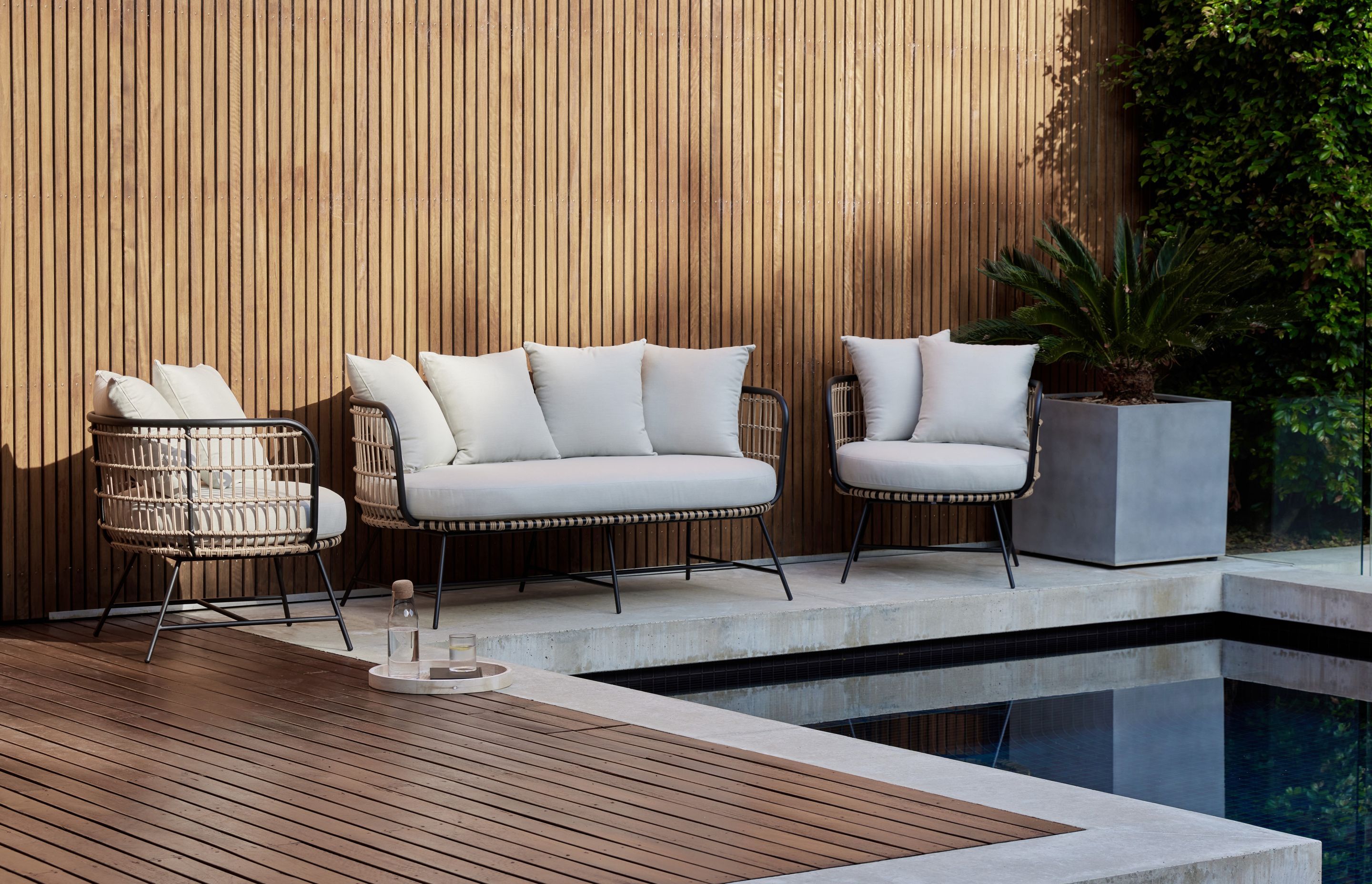 This Arden bamboo wicker outdoor lounge set is wrapped in bamboo wicker.