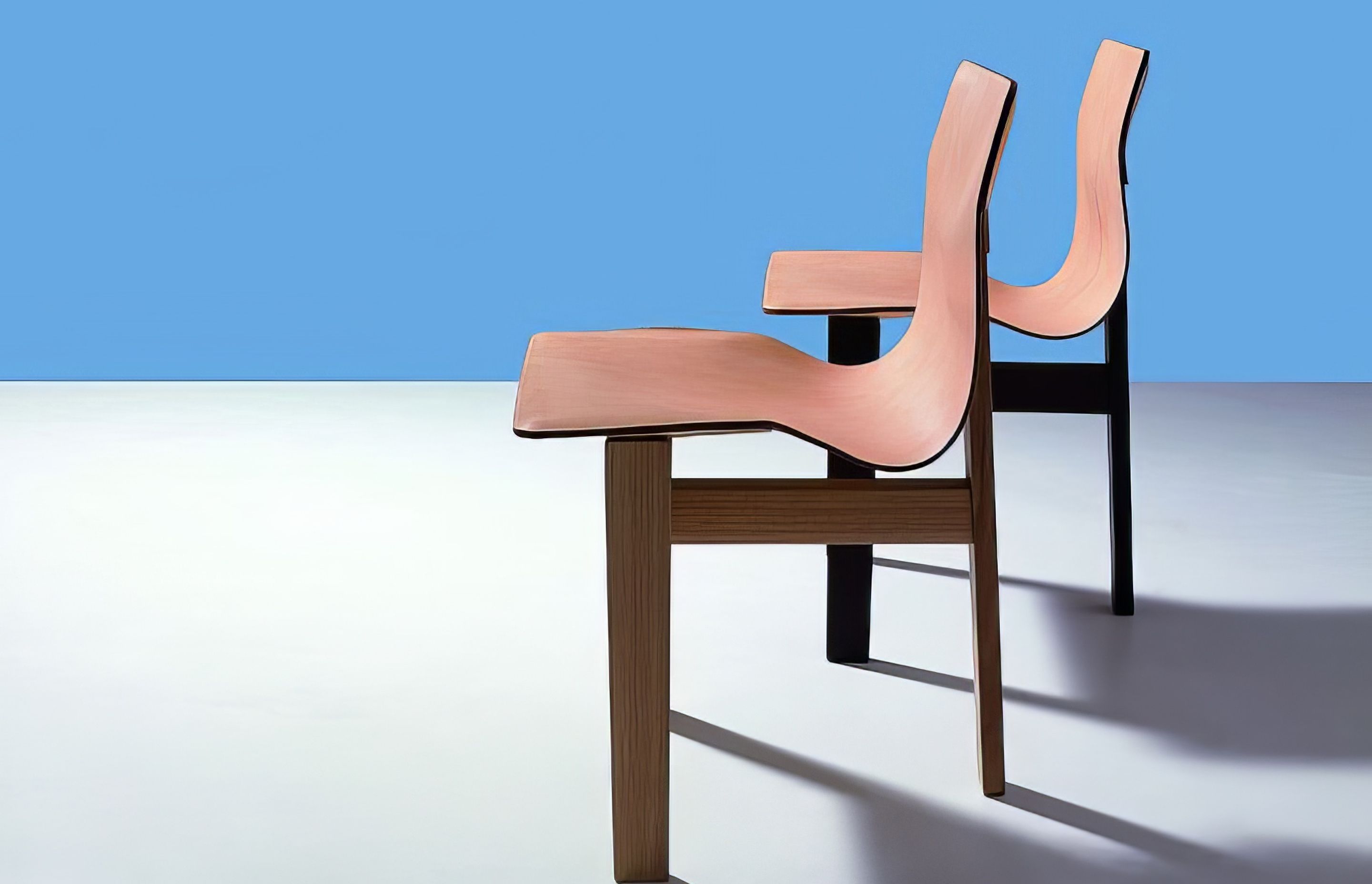 Tre 3 Chairs, one in dark oak, the other in natural oak both with natural leather seats. Designed by Angelo Mangiarotti in 1978.
