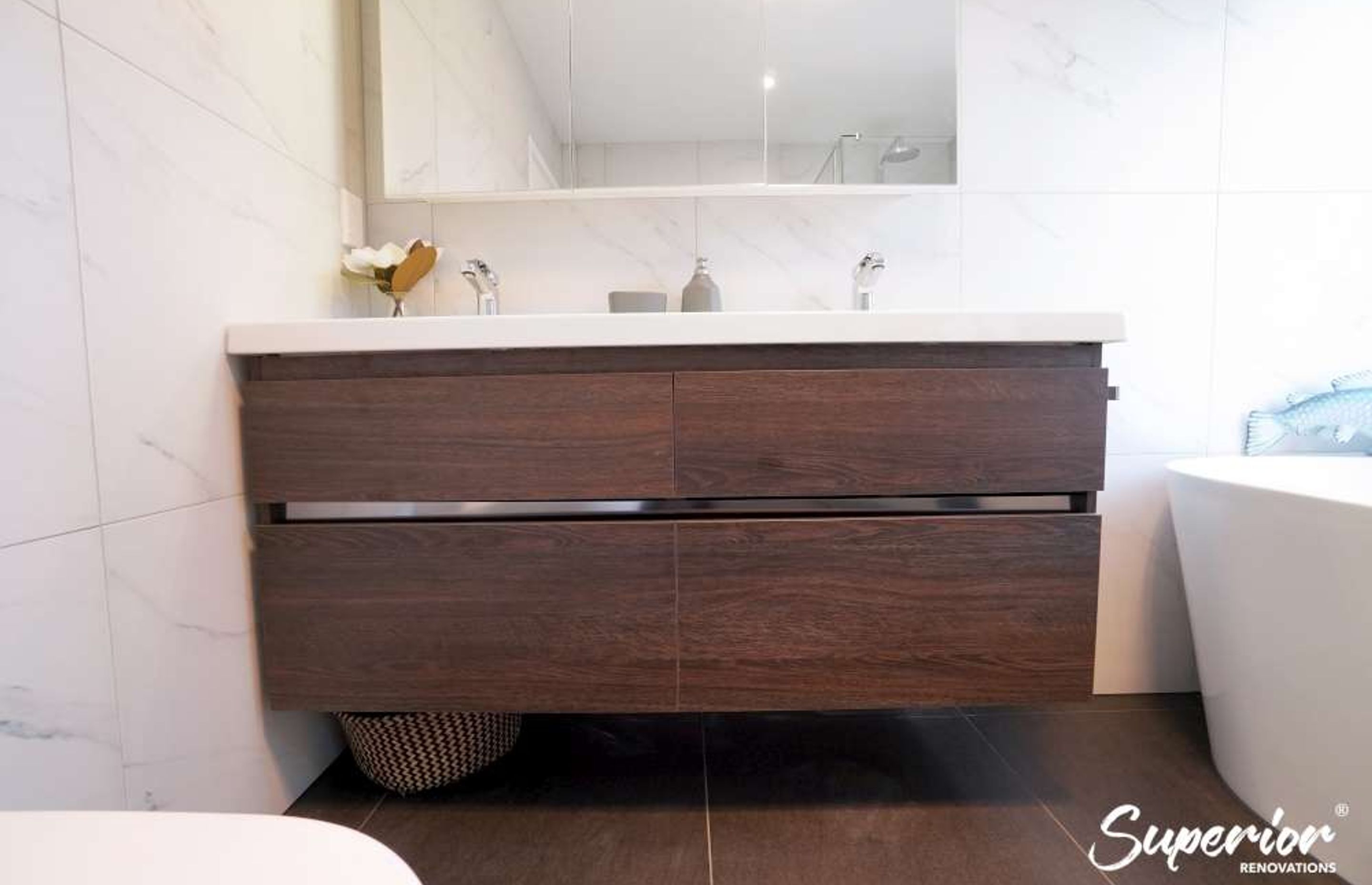 Floating wooden vanity in Albany bathroom renovation