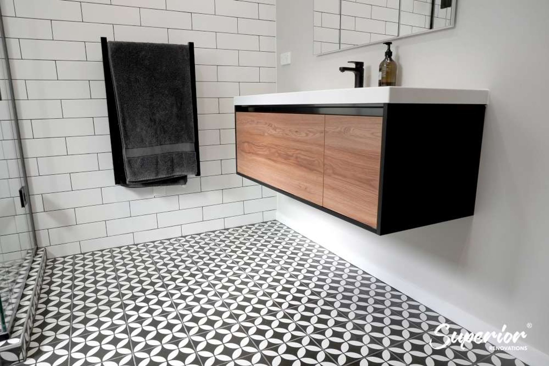 Wooden vanity with a black rim in Titirangi
