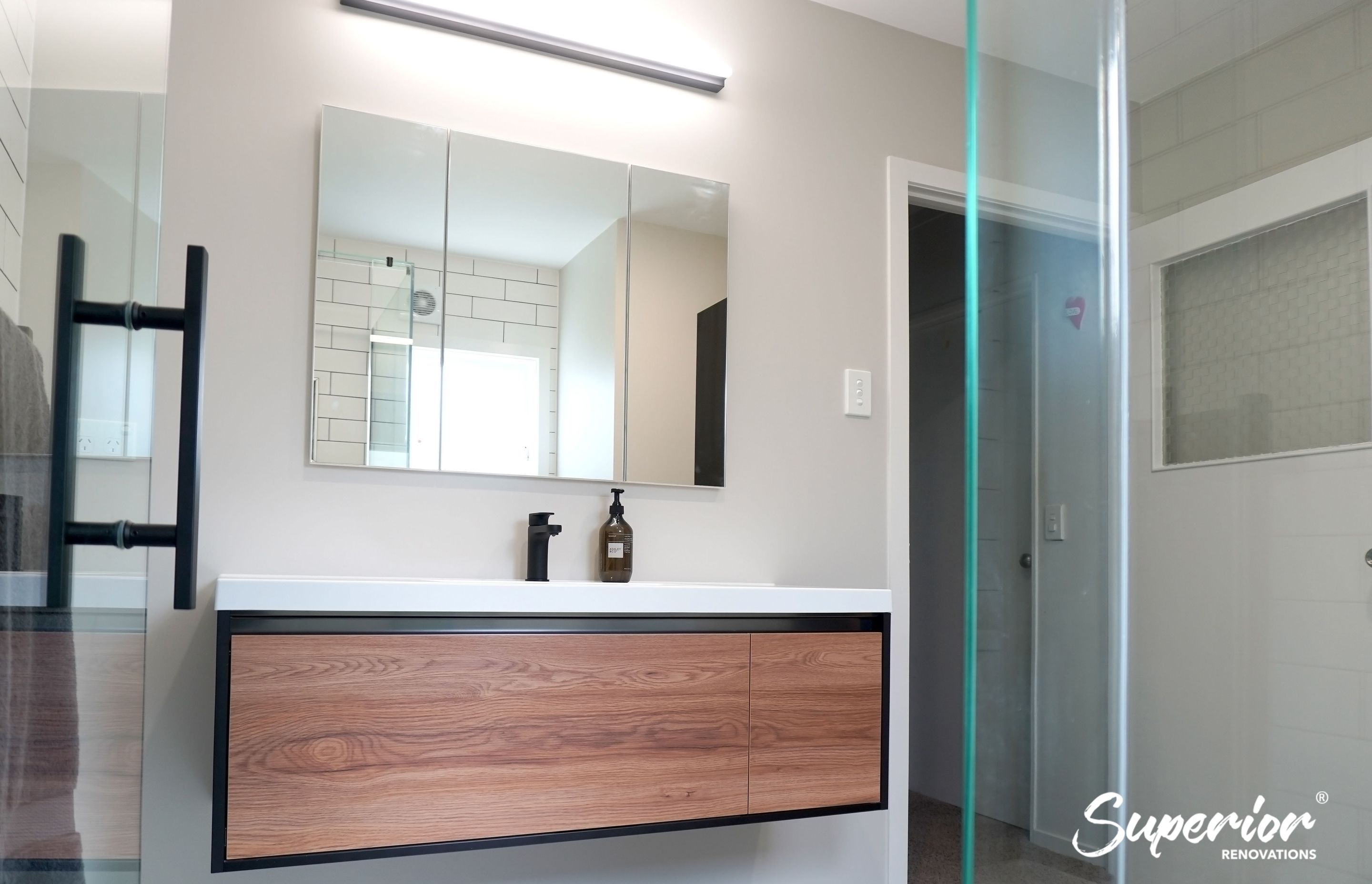 Floating wooden vanity in Titirangi