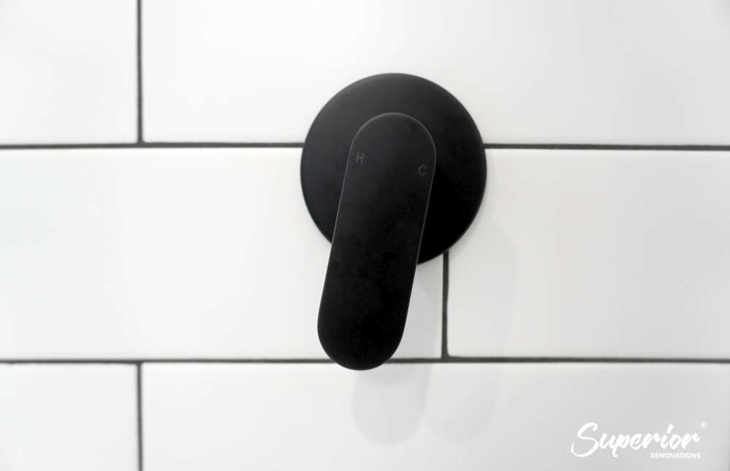 Wooden vanity with a black rim in Titirangi