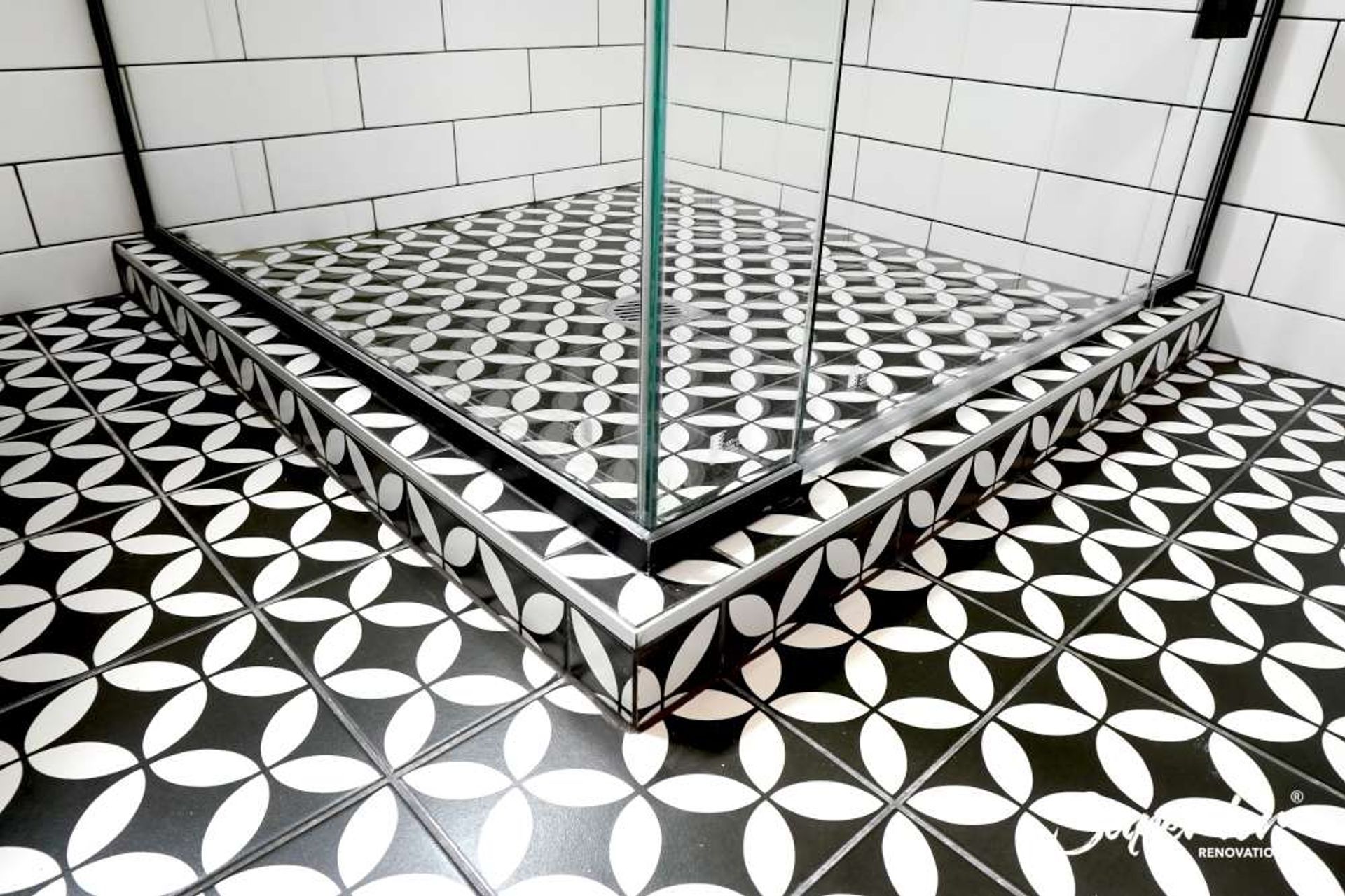 We installed Artisan tiles from Tile depot for the floors which were combined with a floating vanity to give this bathroom a classic contemporary look. The wooden looking vanity with a black rim adds some warmth to the bathroom (Project in Titirangi)