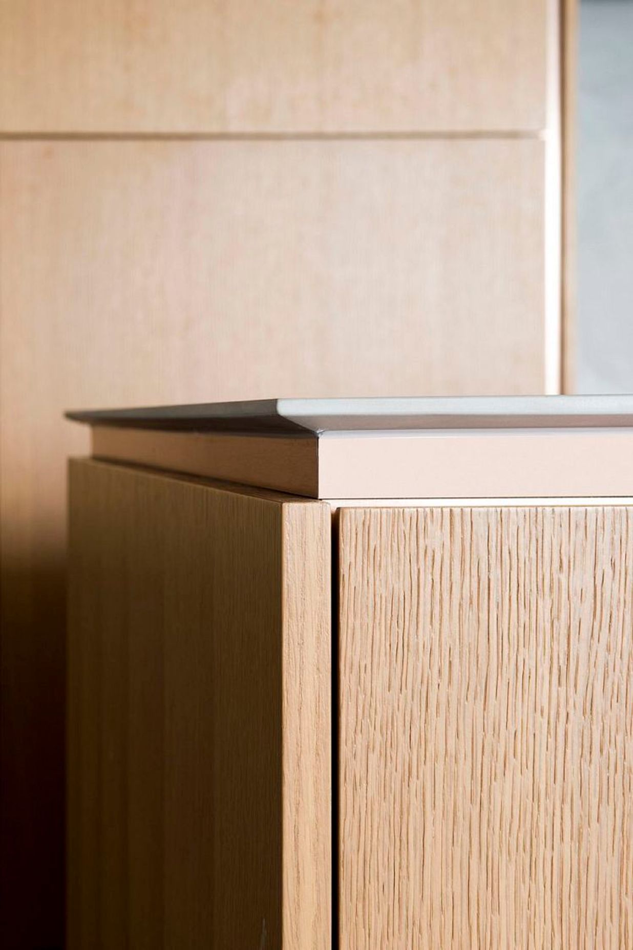 MAXIMUM porcelain panels in Argento 12mm shark-nose edge detail. Magnus Apartments by Cottee Parker