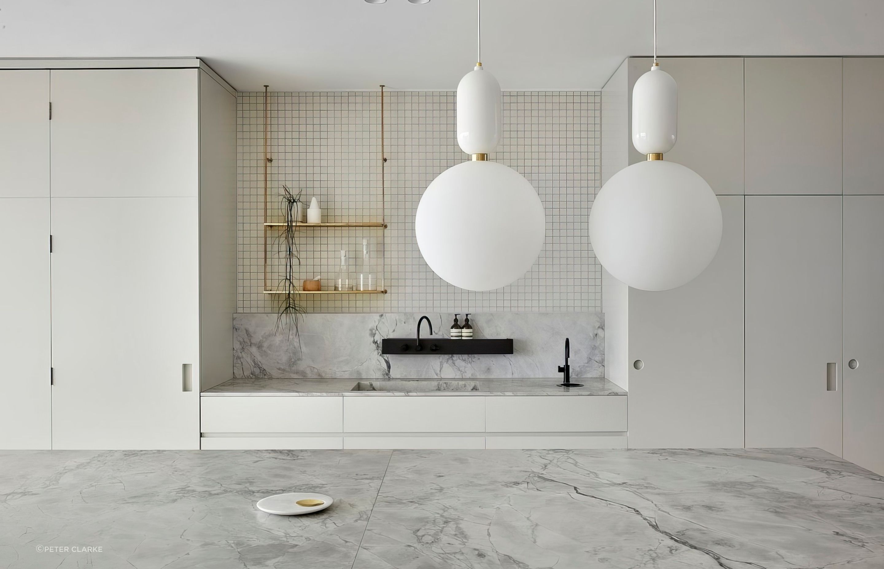 White Fantasy honed benchtops and splashback with Sugie Series Series SU2031 wall. Design by The Stella Collective.