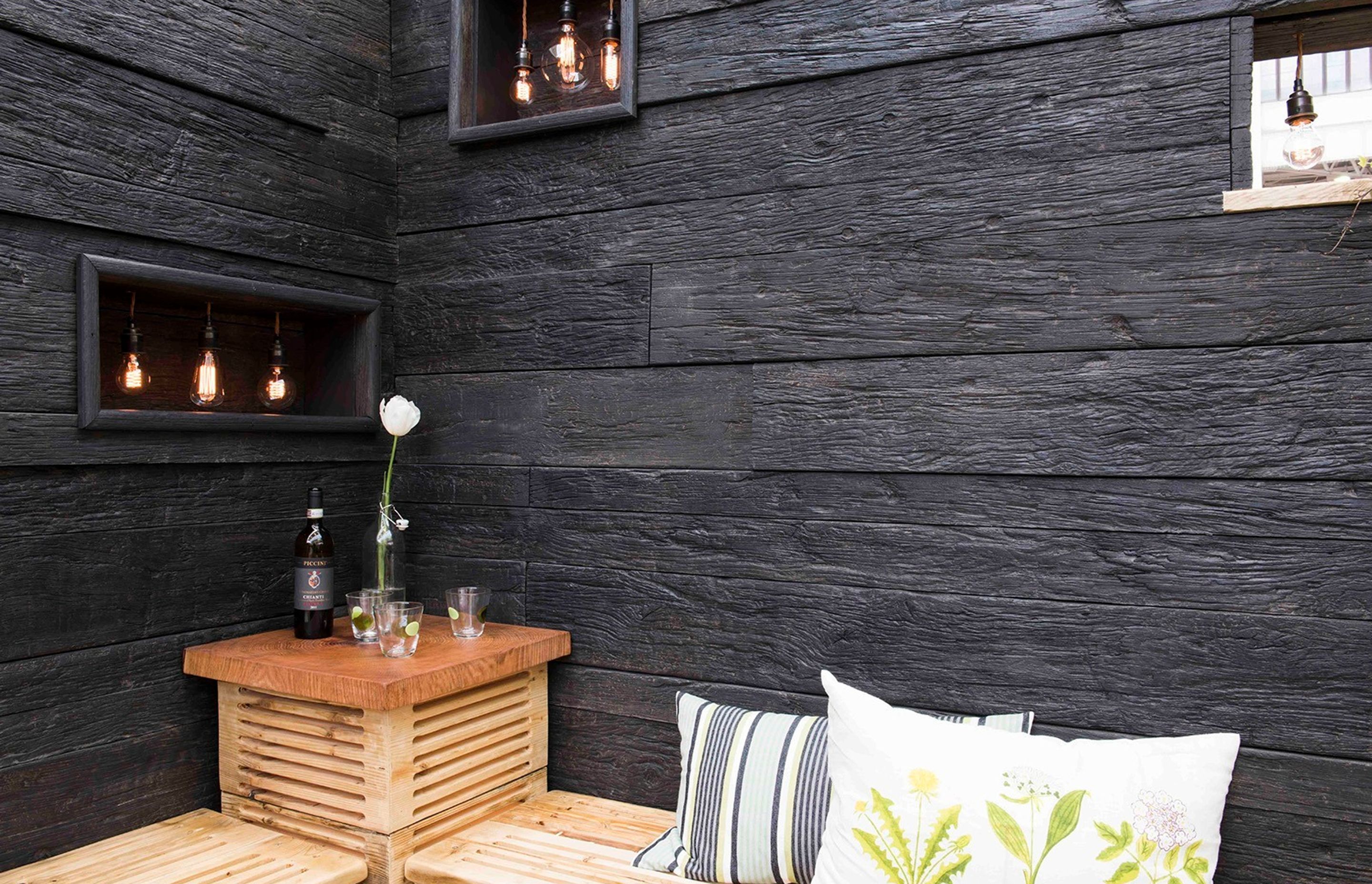Millboard's Embered Oak decking planks were used for this feature wall