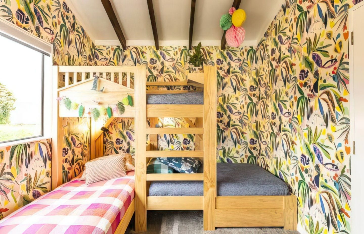 Lloyd says the key to mixing patterns is to know when to stop. She had had her eye on the Kitty McCall wallpaper for some time, but says it would not have worked in the Wellington house, but is perfect for Lilou and Felix’s room in the Mapua house. “People think it's full on doing all four walls in wallpaper, but I think you need a minimum of two,” Lloyd says. “It cocoons the space a bit more.”