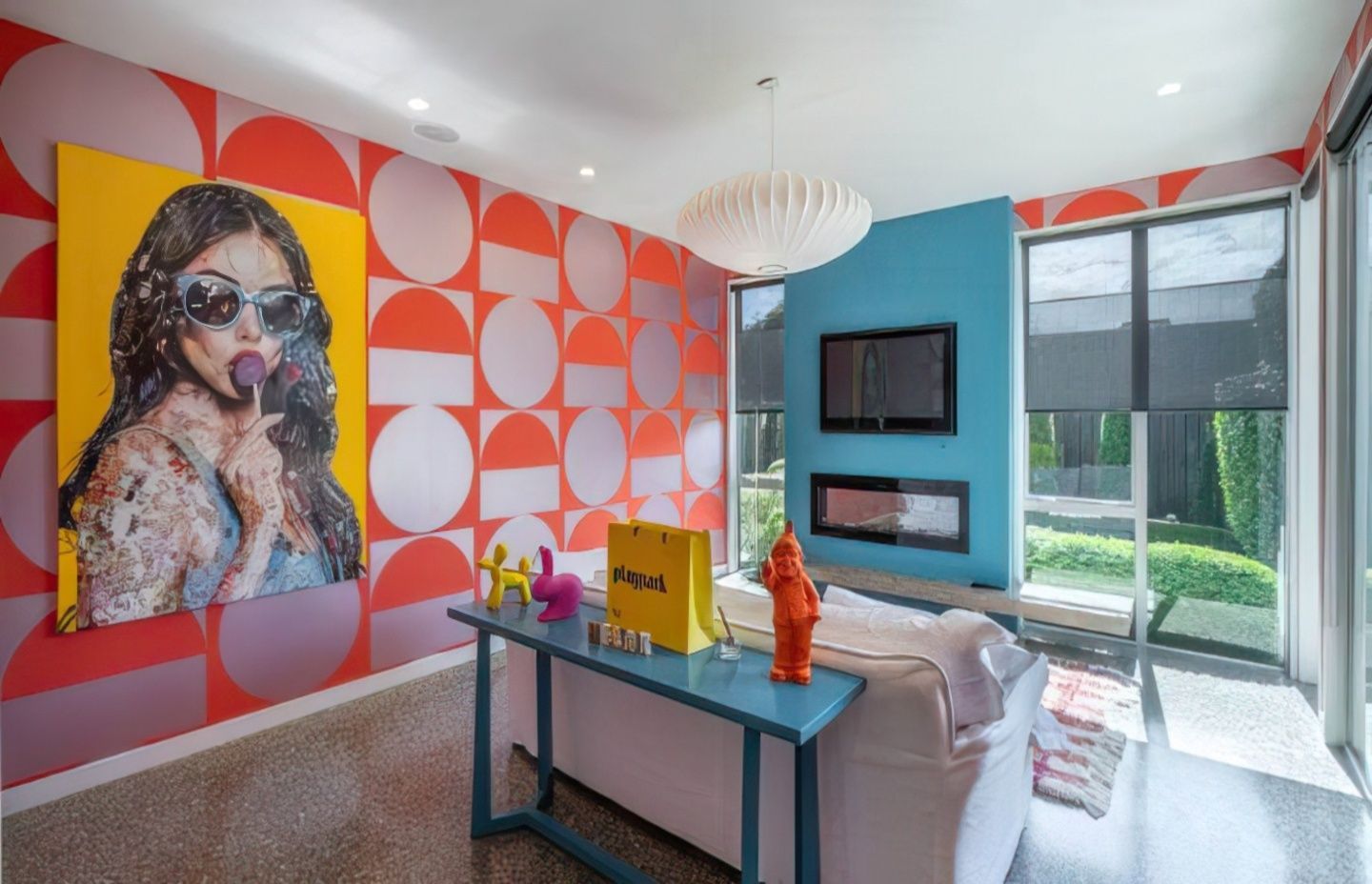 The sunny adult’s retreat can be separated from the main living area, but echoes the colours.