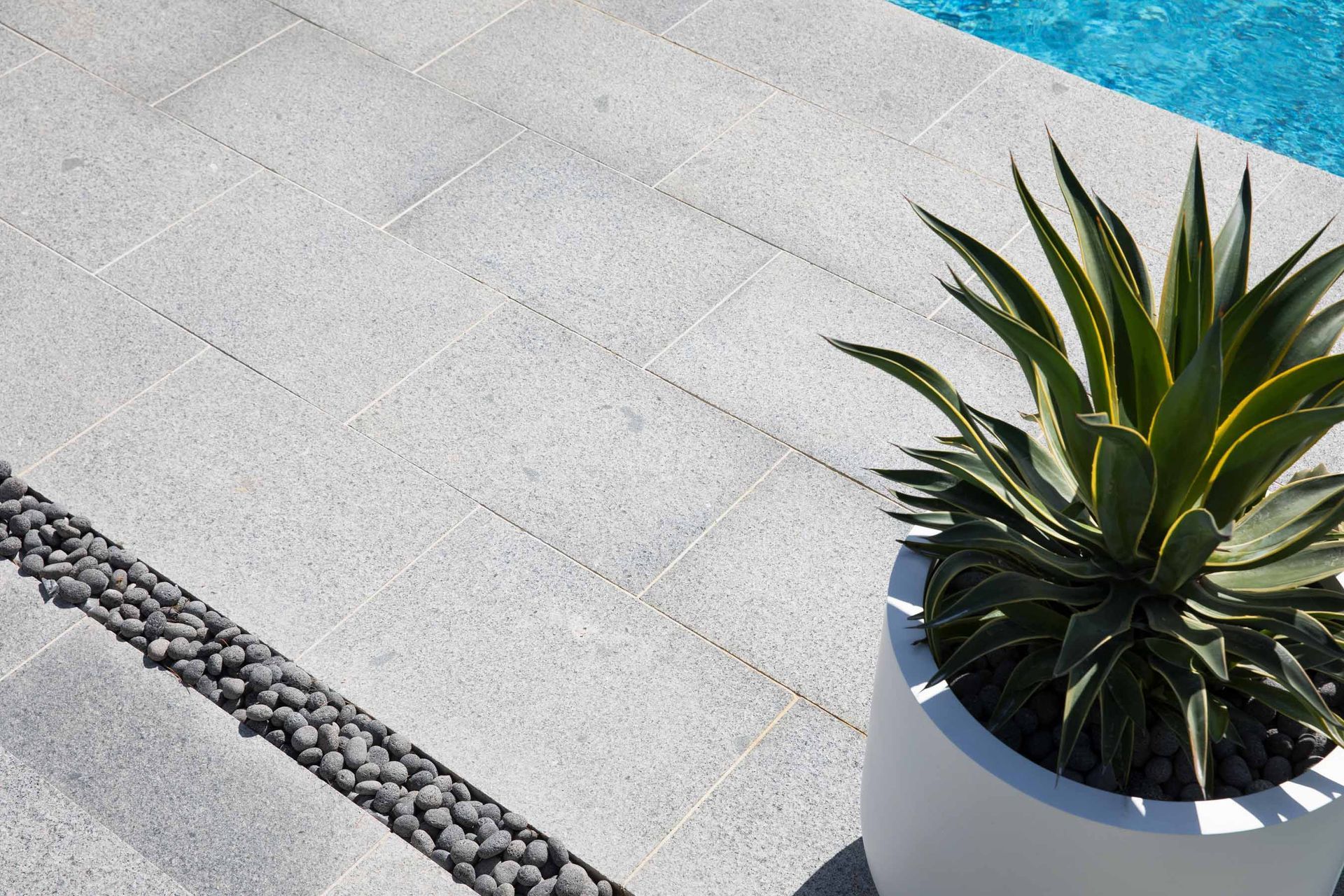 Granite slabs can be used in conjunction with pebbles.