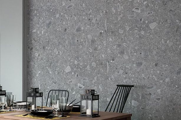 A grey porcelain tile wall with unique patterns.