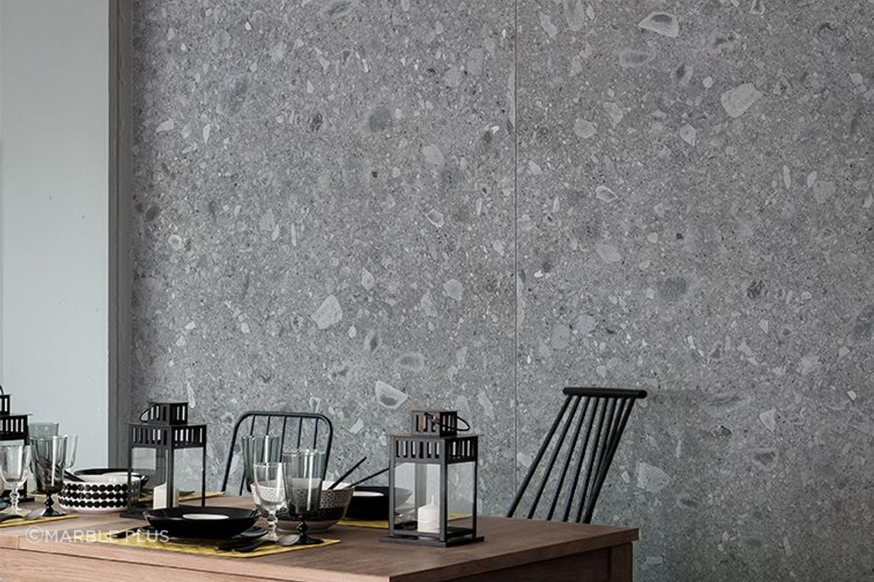 A grey porcelain tile wall with unique patterns.