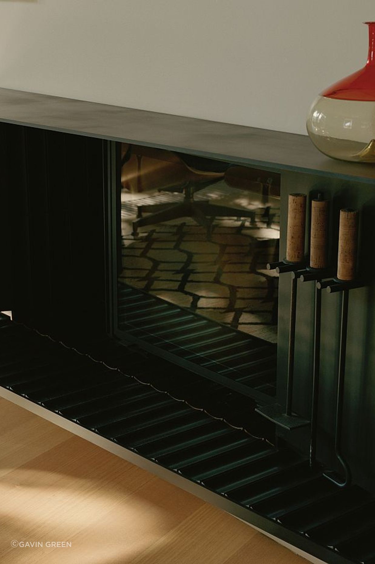 Custom INAX Yumon scalloped tiles on fireplace hearth. Kew Residence by John Wardle Architects.