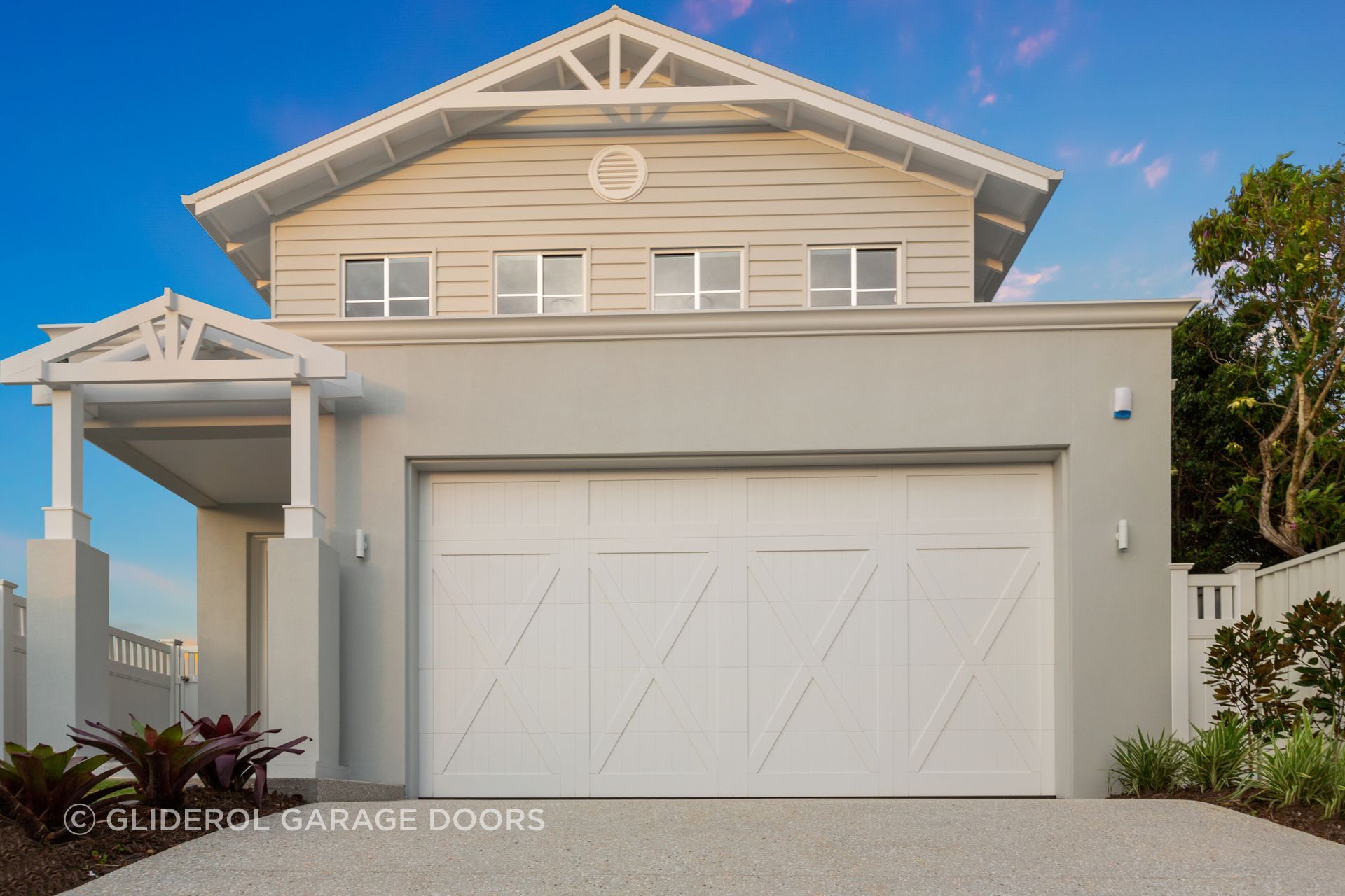 Real Timber Garage Door in the Danmar Carriage Panel design, painted white