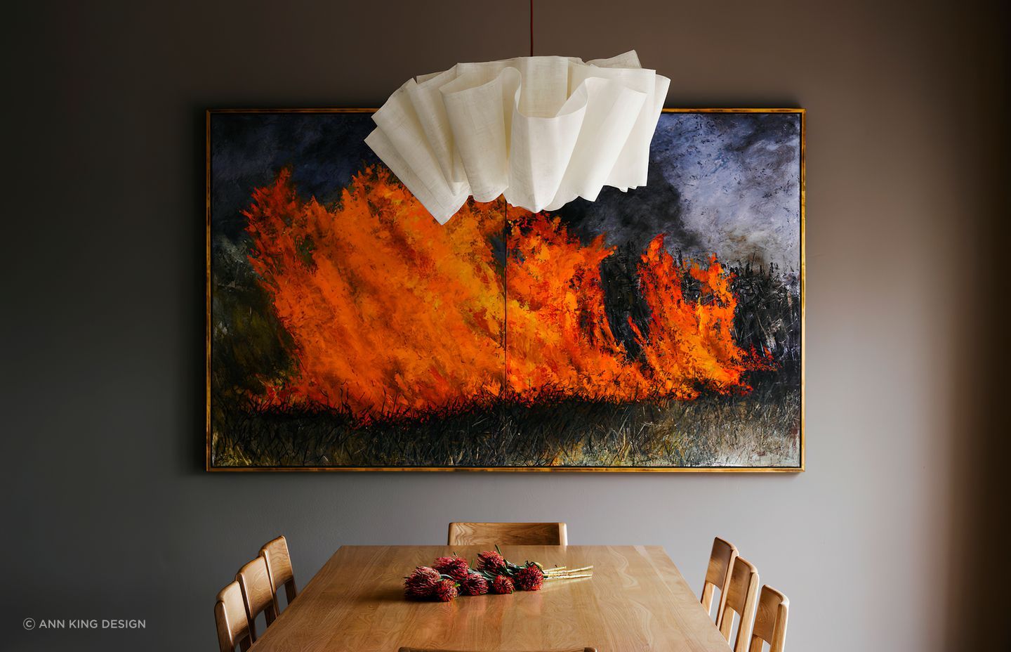 Striking wall art can brath life and emotion into a dining room.