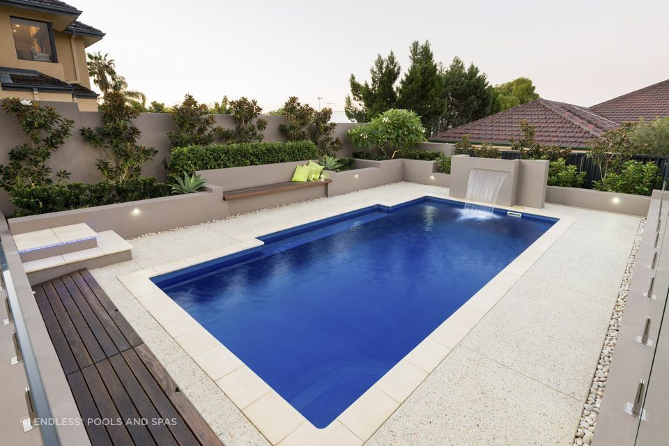 An inground pool with a smooth pool surface