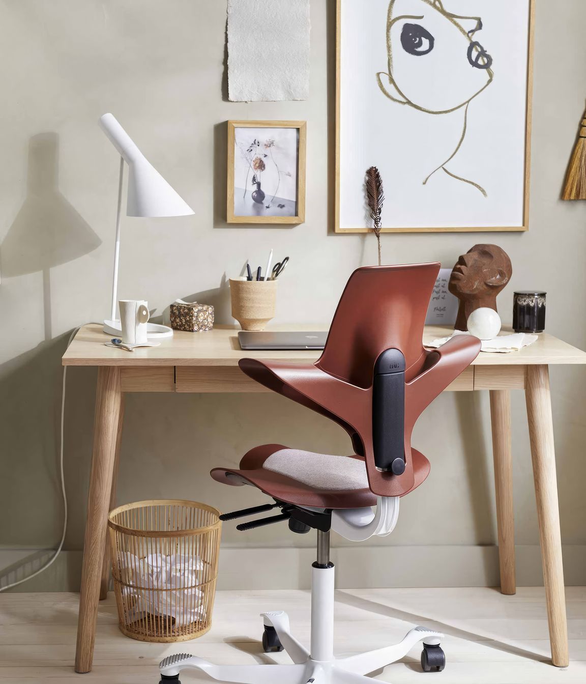 HÅG Capisco Puls is a chair designed by Flokk available with a plastic seat and back made from 100% recycled plastic, sourced from broken snow plough markers.