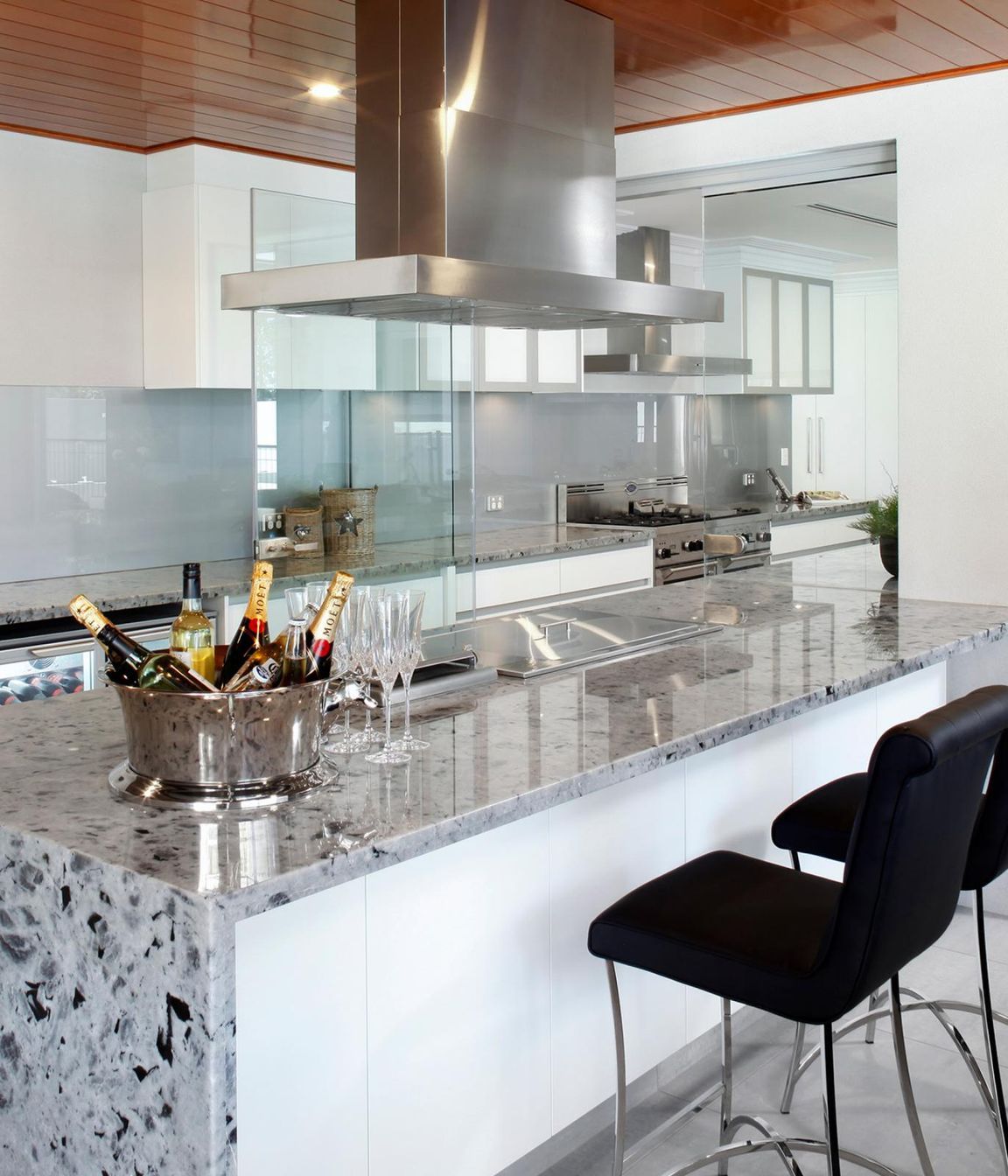 Featuring soft-touch, eye-level controls with a digital display and five speeds, this European-designed island rangehood makes a striking visual statement.
