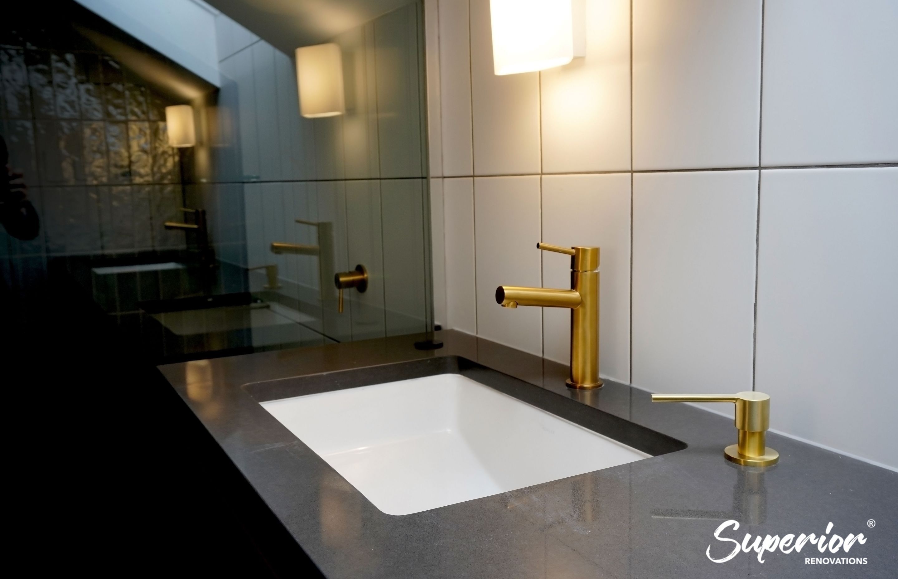 Gold fixtures used throughout the bathroom in Westmere