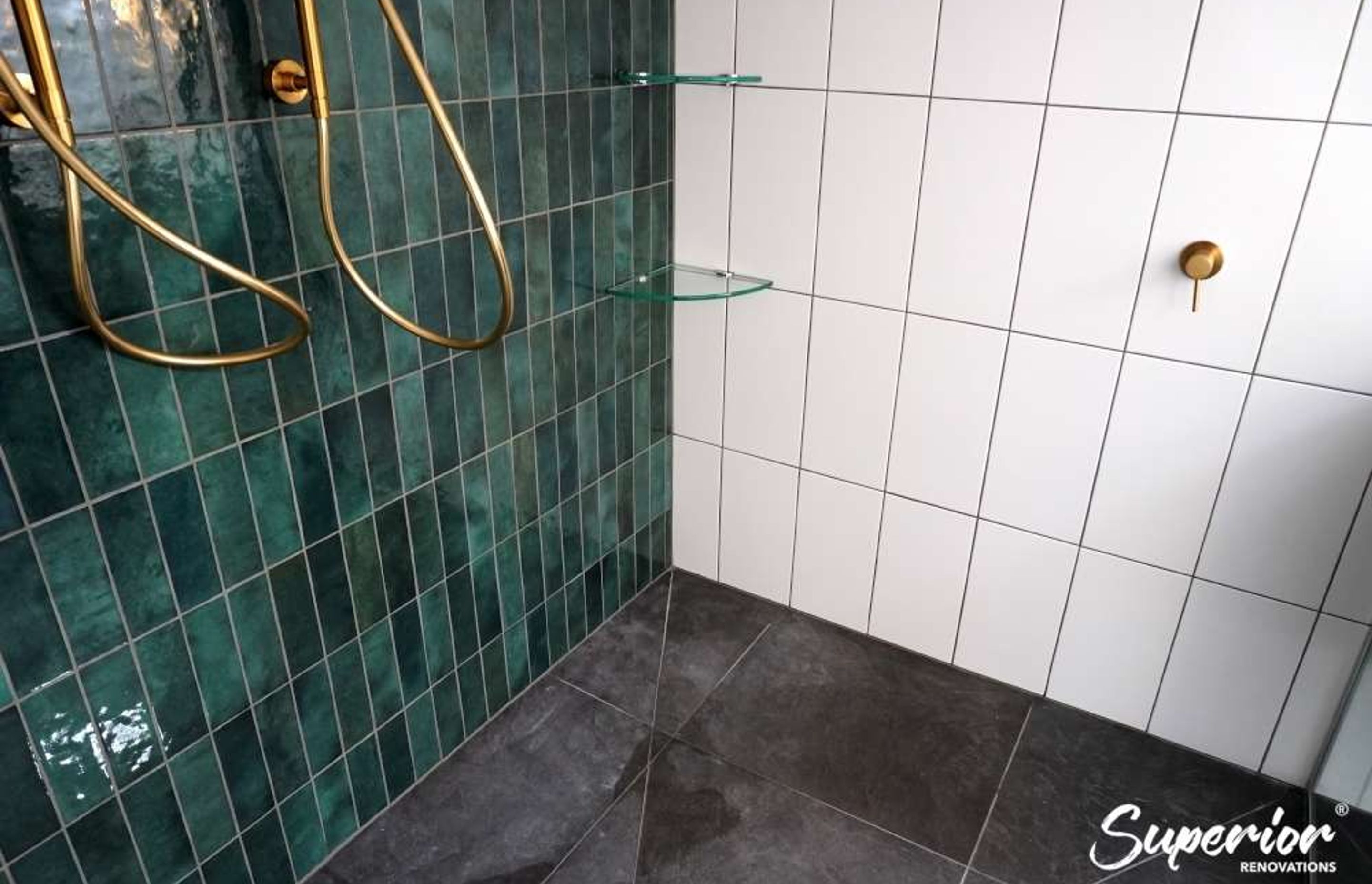 A combination of subway tiles and Casablanca green tiles in a glass shower (Project in Westmere)