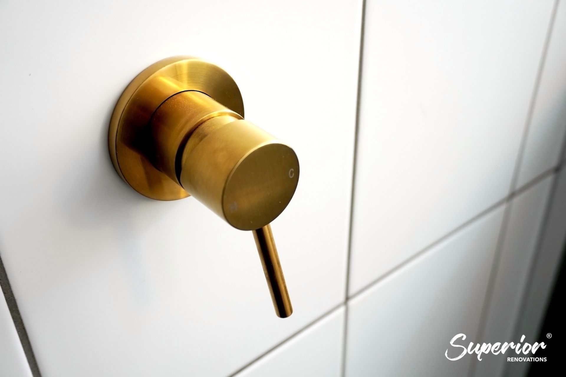 Gold fixtures used throughout the bathroom in Westmere